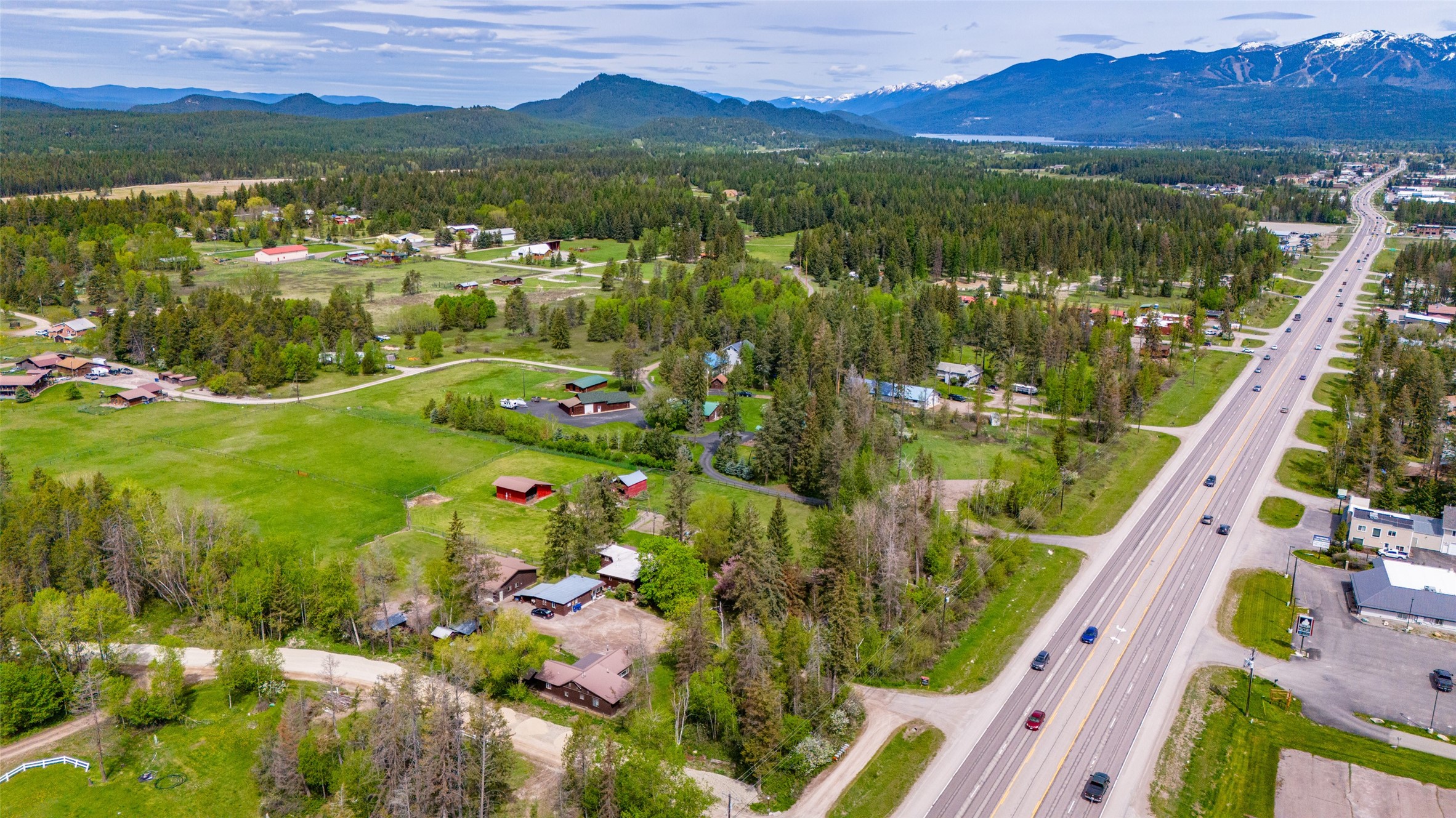 Wide Open Opportunity! This expansive mixed-use property, currently utilized as a residential haven w/ 3 distinct living units, spans 5+ flat & subdividable acres of prime real estate, boasting direct access to Highway US 93 S. Just Minutes from downtown Whitefish, this versatile property offers a wealth of possibilities. BS/HO zoning offers an array of potential uses, making it an ideal investment. Professional offices or creative workspaces, showrooms, farm/equipment sales, light assembly & manufacturing/fabrication to name a few. Additionally, the property offers various conditional uses, including a brewery/distillery, storage facilities, short-term rentals, & even multifamily dwellings. Main house: 2bed/1bath, Guest: 3/1, Apt: 1/1. 2 on-site septic systems to serve a total of 8 bedrooms. Don't miss out on the chance to own a piece of Whitefish offering such diverse potential. Please contact Aaron Noel/Brody Broker Team @ 406-407-4857 or your real estate professional.