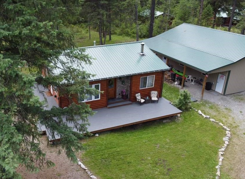 OFF GRID! Tastefully updated 1 bed 1 bath charming cabin with another 1 bed 1 bath guest living quarters in the back of a 30x40 propane/wood heated shop. All near the Clark Fork River and close to Quinn's Hot Springs Resort on 1+ acres. You will love the relaxing atmosphere, wonderful mountain views, and easy river access for recreational use of your choice. This cabin is well maintained and move in ready. This property can be used as a long- or short-term rental! Call/text Rebecca Kovarik 406-249-3719 or your real estate professional.