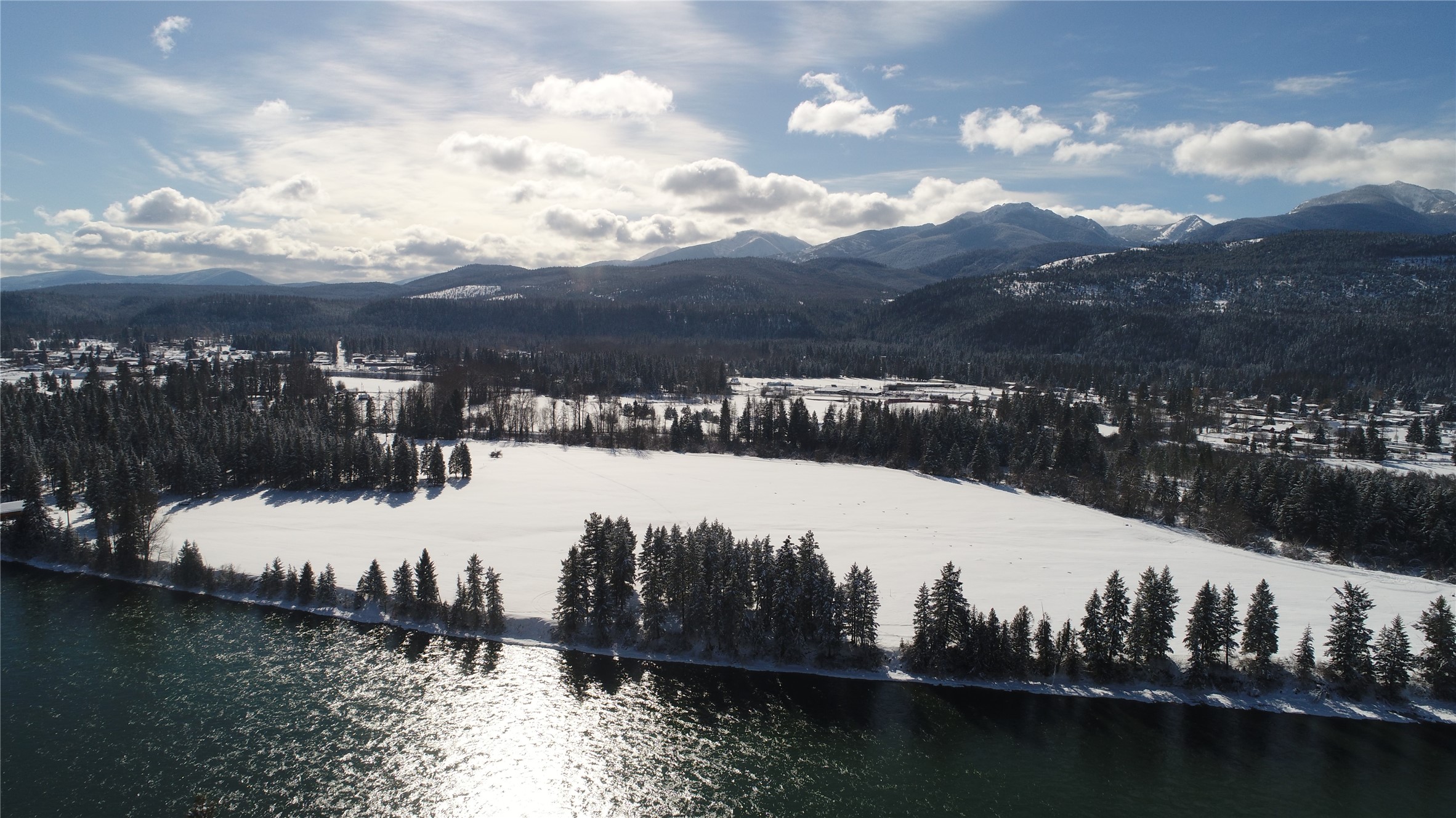 345 feet of Kootenai River frontage! This 9.57 acres is level with some trees and has a 60 gpm well, septic approval and electricity available. With Cabinet Mountain views it is located just one mile from Libby. This property is ready to build and/or farmable. Must see to appreciate! Seller can install electrical service and septic system for additional cost. Listing agent is related to an employee of Seller. Call Chris Faulkner at 406-291-3269 or 406-293-2146 or your real estate professional.