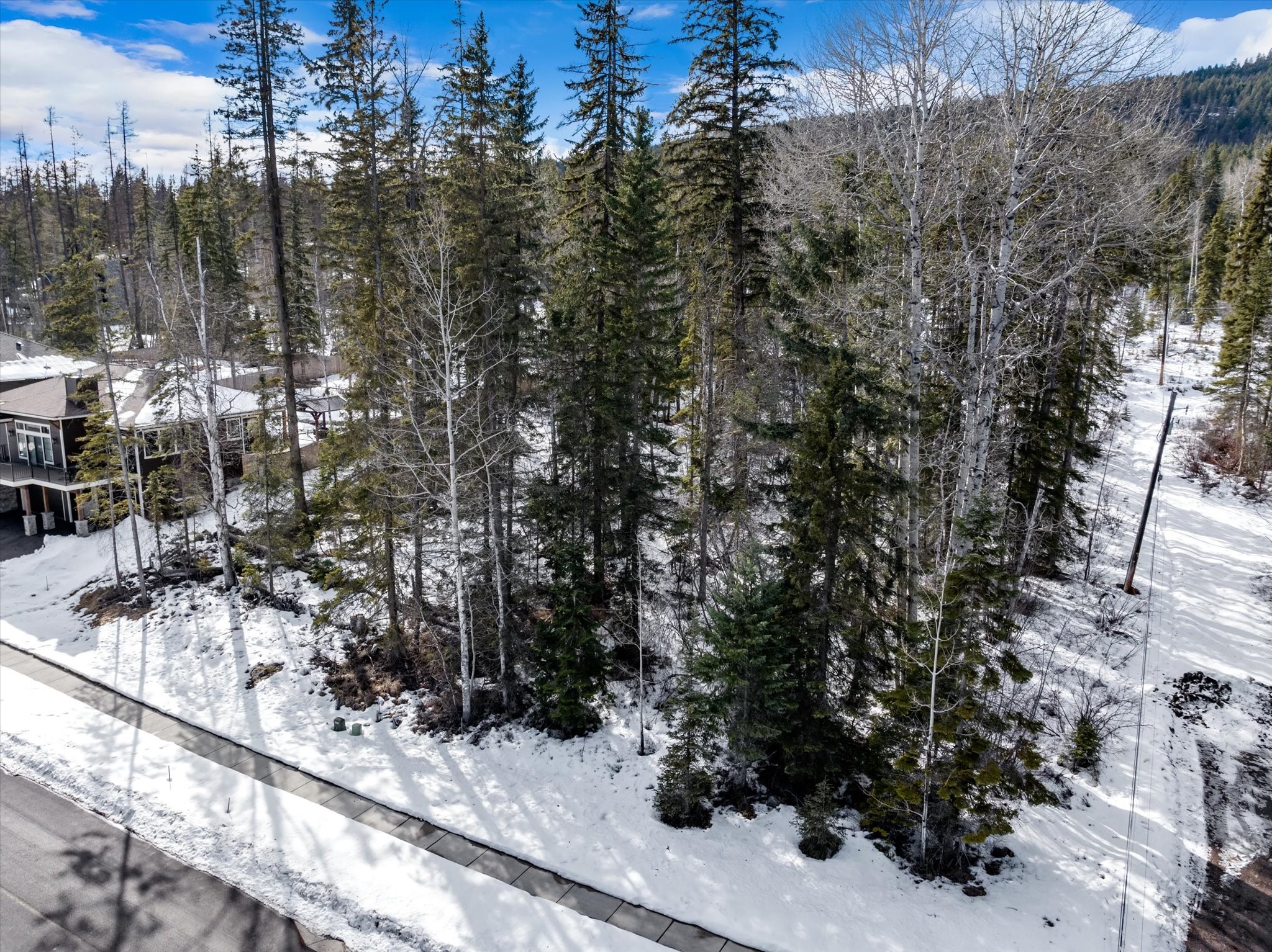 CORNER LOT AT THE END OF A QUIET STREET! Build your dream home on this gently sloping lot in an established neighborhood. Icehouse Road has great views of the ski resort. Walking distance to lake access at Whitefish State Park, close to Whitefish Trails and the Whitefish Lake Golf Course.  This lot is actually larger than advertised due to the City of Whitefish deciding not to add a street at the back portion of the property.  Please see private remarks and documents for further details. Please call Derreck Thompson (406) 261-8431 or your real estate professional for more details.
