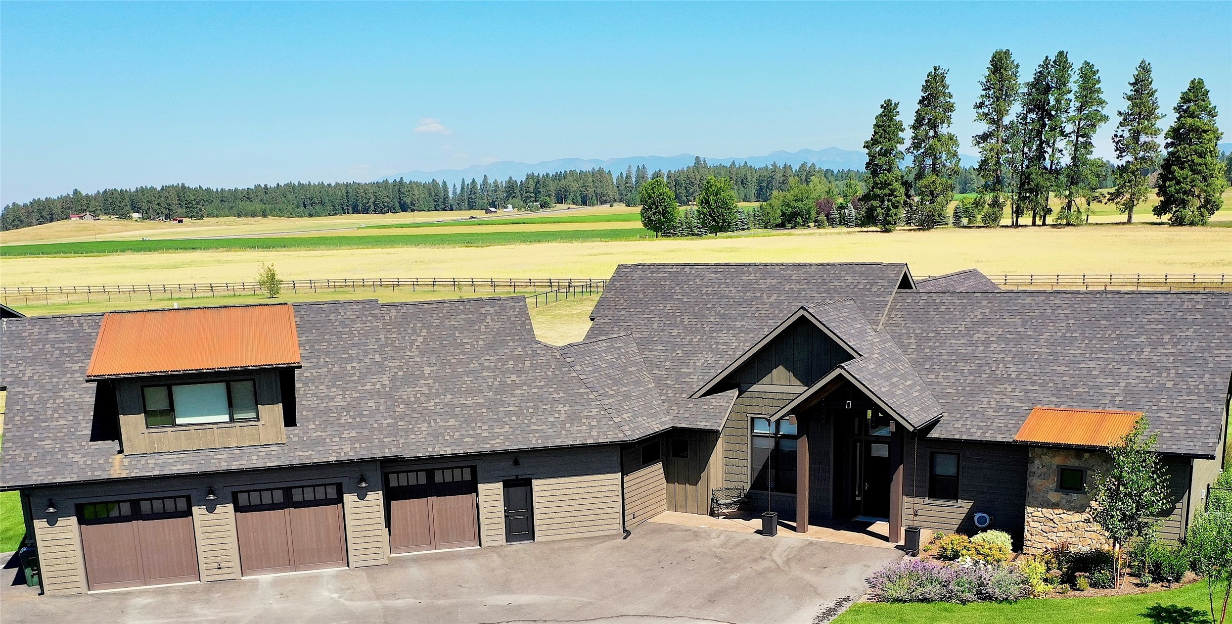 Breathtaking 360 views surround this gorgeous Montana Custom Home on 2.21 ac. located in the coveted Sweetgrass Ranch Subdivision. 
This Custom 2021 Home has 3,301 sqft of living space with high-end amenities. A 1,045 sqft one-bedroom apt, with a separate entrance, is above the oversized, heated 3-car garage. This open floor plan is a 3 Bed, 2.5 Bath, w/custom office, flex room, & a large bonus/rec room. A gas stone fireplace enhances the living area with slider doors that open 8 ft to the LG covered patio. Enjoy the magic of MT with outdoor entertaining, and relax with incredible sunsets while taking in the Columbia, Swan, and Big Mountain views. Vaulted fir beam ceilings, dining area, gourmet kitchen. Private Primary Suite with tiled walk-in shower, dual sinks, and 2 custom closets. Conveniently close to Kalispell shopping, and surrounding towns. Close to Glacier Park, Flathead River Access, and GNA Airport. Call Tricia Weimer at 406-890-3426 or your Real Estate Professional.