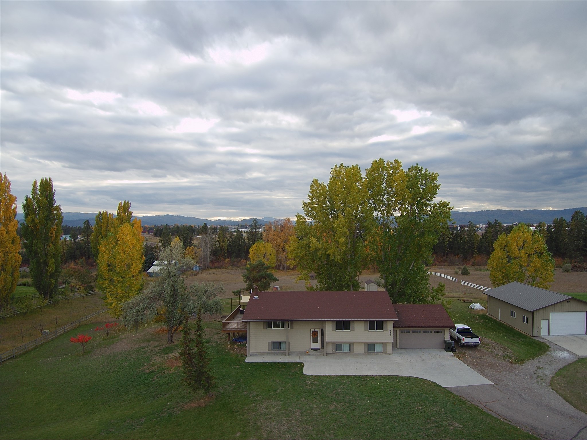 Rare offering! Great location adjacent to Kalispell, this 4-bedroom + office, 3-bath home on a 5-acre lot has approximately 350' of Stillwater River frontage, a 30'x40' shop, and views of the Swan mountains. Who says you can't have it all? The home features a large deck, attached double garage, natural gas heat and fireplace, master bathroom with a claw-foot soaking tub, large family room in the lower level, updated kitchen and great built-ins in the living room. Store all of your toys in the 1200 square foot shop. Outside is a dog run, a garden spot, and beautiful mature trees. All of this is located in a lovely neighborhood that is very convenient to the shops and restaurants at the north end of town, along with close proximity to medical facilities and the hospital. Call Bill Leininger at 406-253-7333 or your real estate professional.
