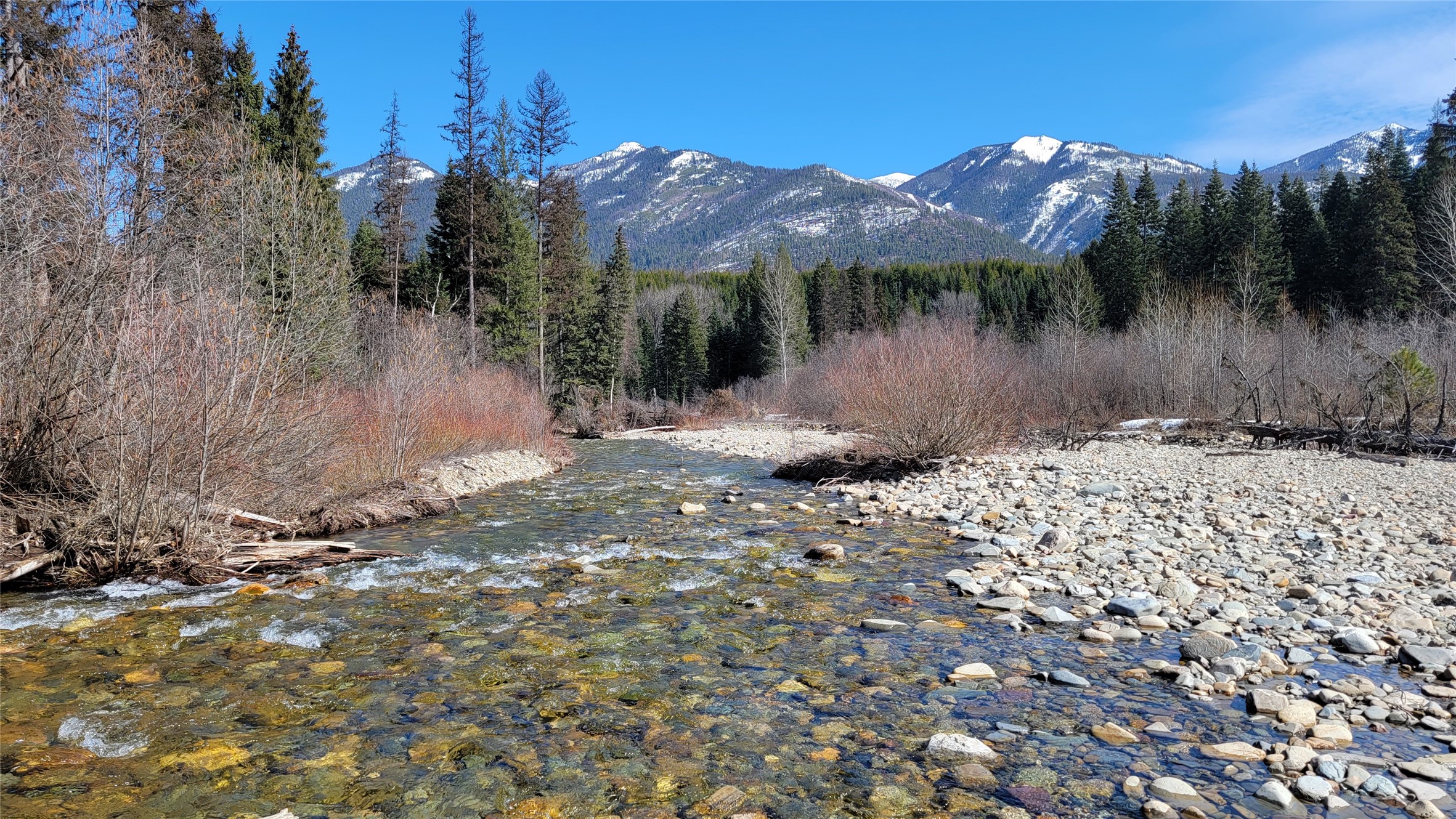 9 level acres on Keeler Creek located between Troy and Bull Lake, 7 miles from Highway 2. The property is timbered with 825 feet of private and useable creek frontage. Ready to build land with utilities and septic approval. Located only minutes away from local area attractions such as Bull Lake, Ross Creek Cedars, and Kootenai Falls. Seller can install electrical service and septic system for additional cost. Listing agent is related to as well as an employee of the seller. Call Crawford Dinning at 406-291-5577 or your real estate professional.
