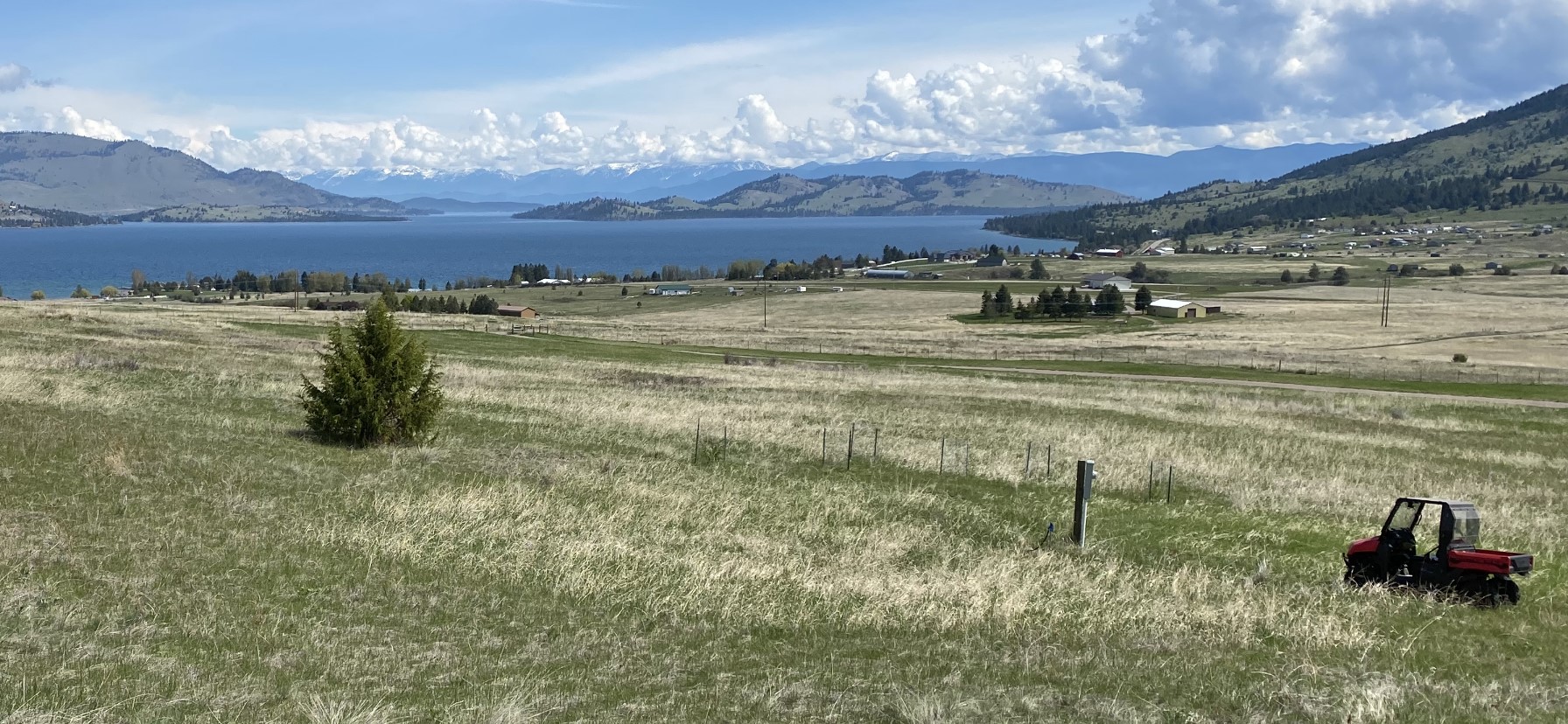 Stunning views overlooking Flathead Lake with Wild Horse Island in the forefront and Swan & Mission Mountain ranges in the background.  Five minutes to Big Arm Marina and State Park boat launch.  Ability for future option to subdivide into two 5-acre tracts for two incredible building sites.  Bordering State Lands, corners marked, approved for septic with county DEQ, power to property and fully fenced.  Mild winters and easy access with option to adjust current owners access road if desired. Located approx. 20 minutes to Polson, 45 minutes to Kalispell and about an hour to Glacier International Airport. For more information, contact Tracy Rossi at 406-763-6808 or your real estate professional.