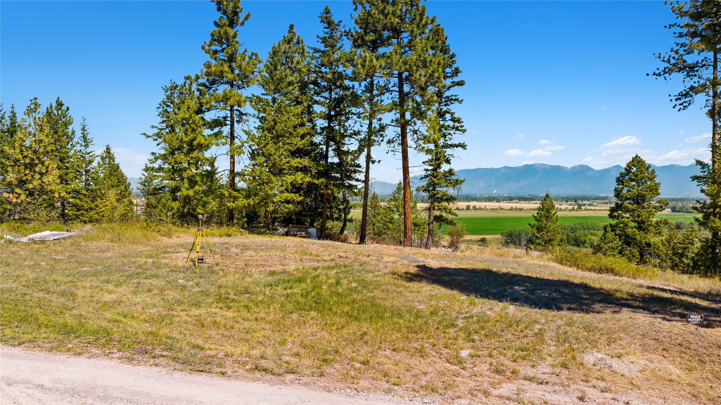 Remarks: Call your builder! Great opportunity on this private, clifftop 4+ acre lot, conveniently located only 6 miles south of downtown Kalispell. Breathtaking views North to Glacier National Park and Big Mountain! Or stare due East at the Swan and Jewel Basin Ranges! Several options for building sites throughout the mixed terrain. No CCR's or HOA. Electric is at the property line. Opportunity to share well with seller who lives on neighboring parcel, with a 60 gpm well. Recent survey conducted with all corners pinned and angles flagged. Septic perc'd and surveyed. Wildlife including deer and elk frequent the property regularly. Seller financing available on this peaceful country setting parcel. Call John A. Busic at (406) 298-3050, or your real estate professional. Buyer Financing - min. 10% down, 5% APR, seller carry back note to be negotiated. There is a discrepancy on the lot size between what Cadastral lists (3.54 acres) versus what the recent survey (4.05 acres) says.