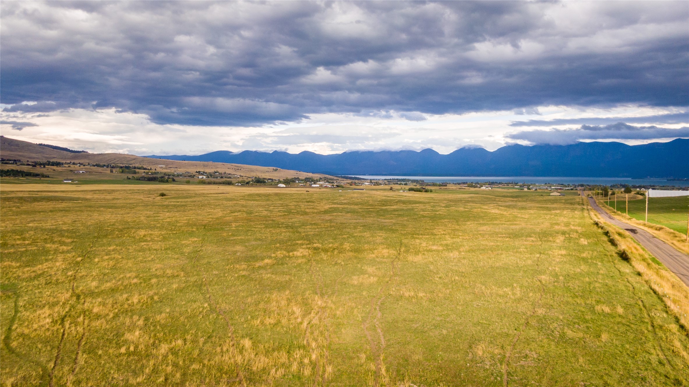 Check out the Flathead Lake views from this 20 acre parcel of land!! There are light covenants in place but do allow for Barndominiums, shophouses or stick frame and  up to 5 out buildings. livestock is welcome. The topography of the parcel affords a good bit of privacy.  Call Bo Carpenter @ 406-212-2233 or your real estate professional.