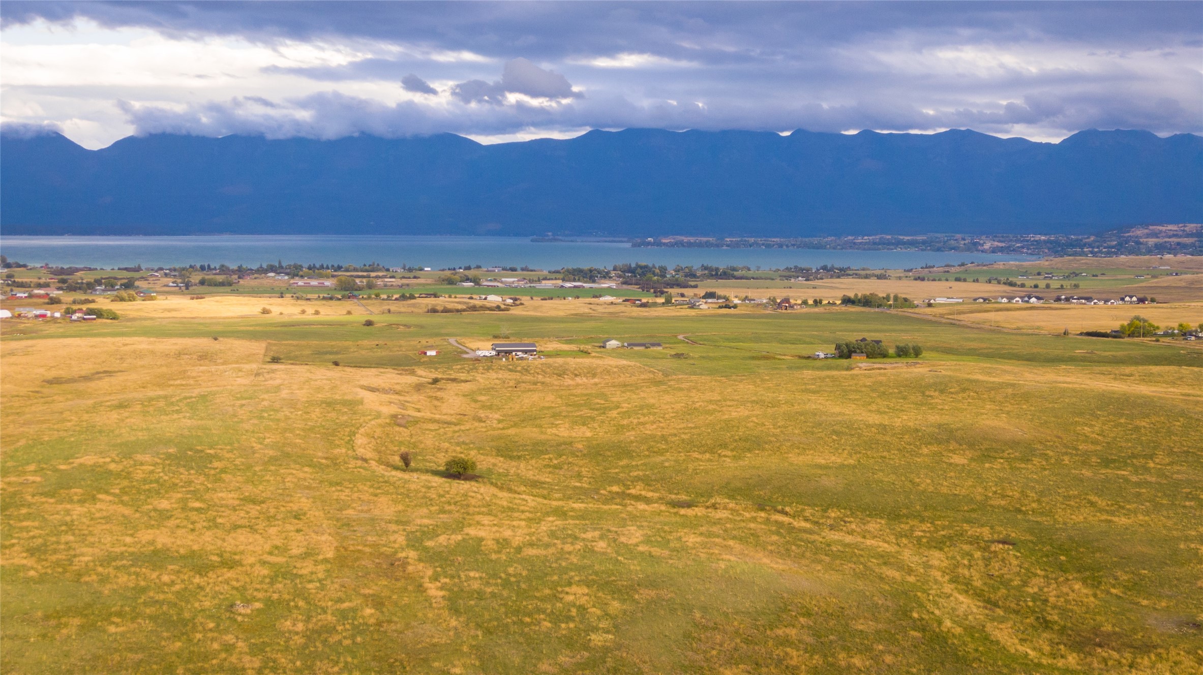 Check out the Flathead Lake views from this 20 acre parcel of land!! There are light covenants in place but do allow for Barndominiums, shophouses or stick frame and  up to 5 out buildings. livestock is welcome. The topography of the parcel affords a good bit of privacy.  Call Bo Carpenter @ 406-212-2233 or your real estate professional.