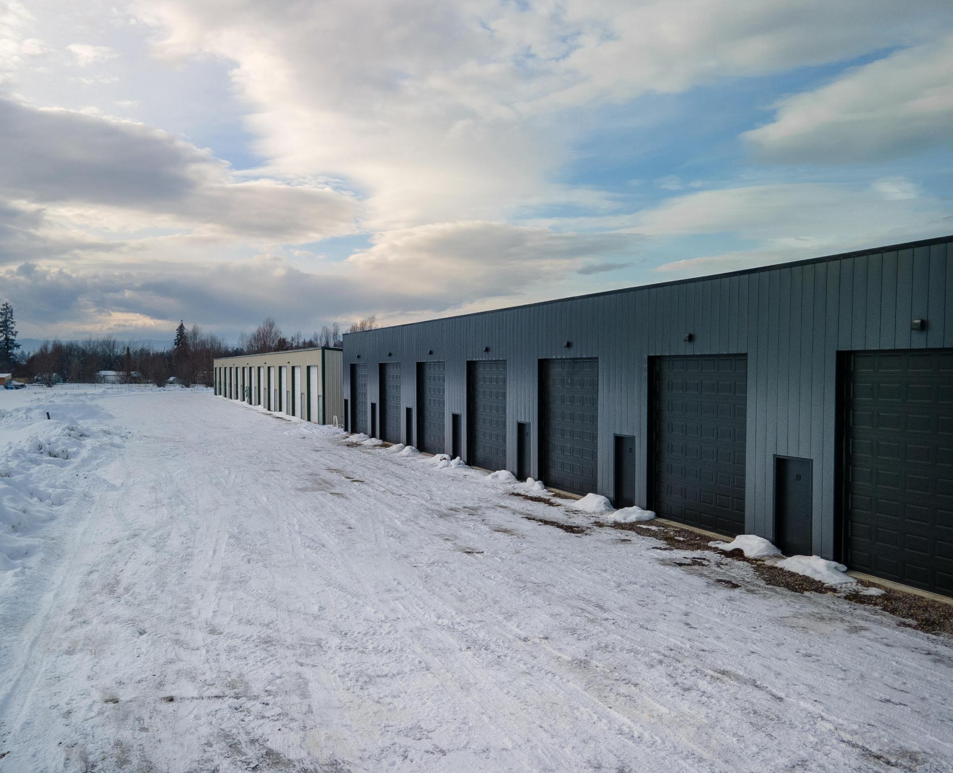 Here's your opportunity to own a brand new 20' by 50' storage condo with a 14' door. Ceilings are 14' tall in the back and 18' tall in the front. Use it to store your big toys, RV's, tools, etc. Need overflow storage for your business? Here's your answer. Need to move your small business somewhere bigger than your extra bedroom? Look no further. This is a new build and will have updated finishings compared to the existing units. Contact Kristin Zuckerman (406) 291-0778, or your real estate professional