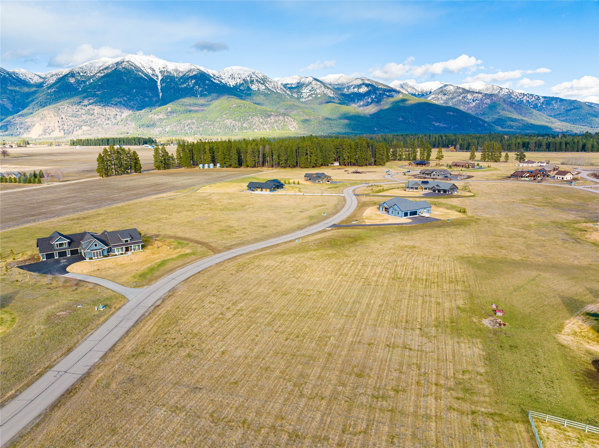 If you are looking for the ultimate Montana mountain views, then you need to come home to Sweetgrass Ranch. In addition to the panoramic views you will enjoy the deer, elk, eagles, hawks and other wildlife that visit this area. This lot offers public water, electricity, telephone, natural gas and fiber optics. Located near Glacier National Park, Whitefish Mountain Resort, Flathead Lake and within 10 miles of downtown Kalispell.