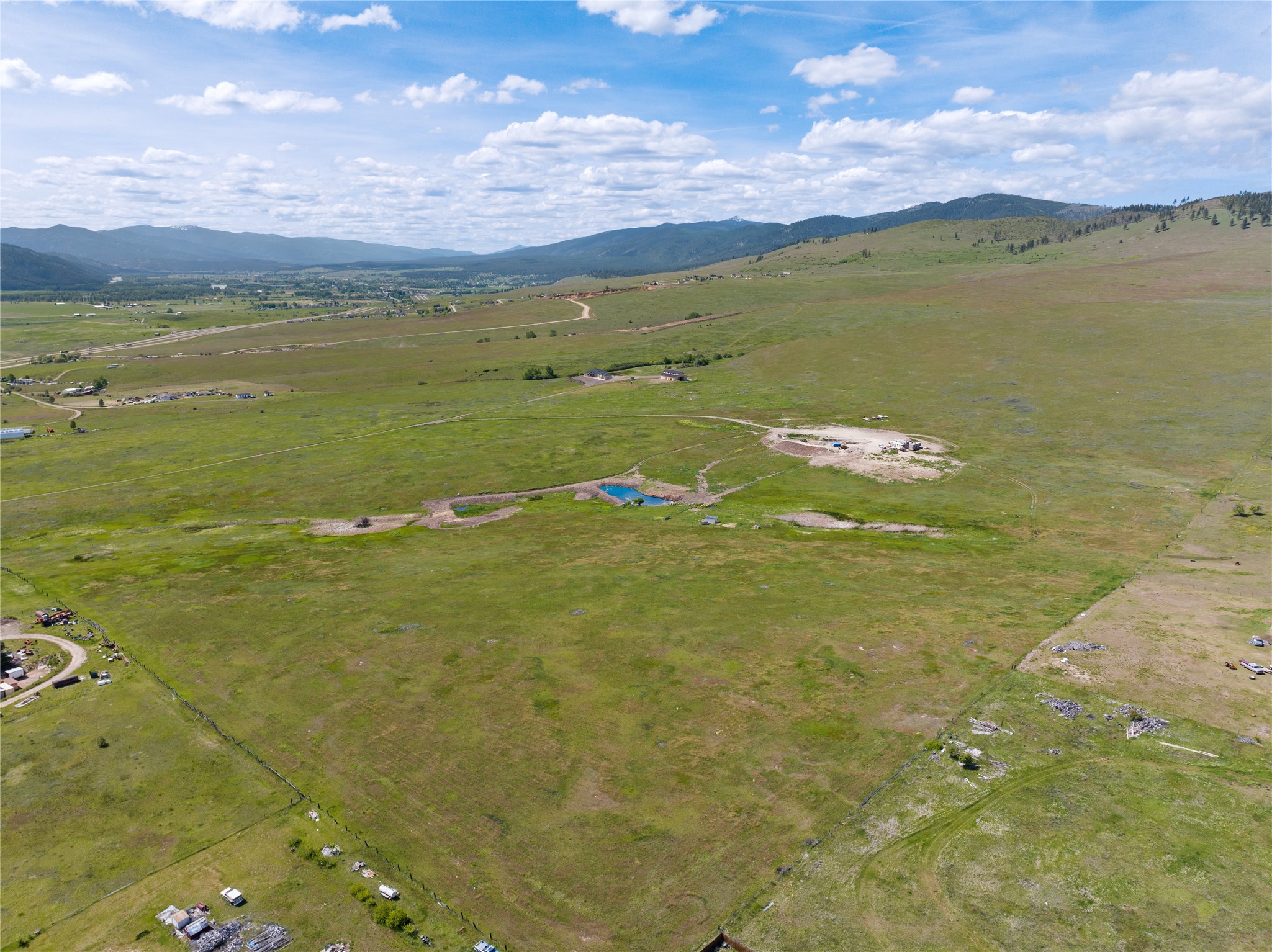 Developer opportunity! Multiple wells already on the property. Only 15 minutes from Missoula International Airport, this 175-acre parcel is conveniently situated on the outskirts of Missoula and close to the amenities that a city has to offer, yet has the privacy and acreage of rural living. Set back on the Frenchtown Frontage Road, you will have easy access to Interstate 90 but without the disturbance of freeway traffic. The Snowbowl Ski Resort is less than 20 miles away, with other ski options at nearby; if relaxing is more your style, three different hot springs are all within an hours’ drive away. From the home site, enjoy the views of the surrounding mountains and down into the Bitterroot Valley while watching the wildlife, or your own domestic livestock, that roams on and around the property. There is a building site already prepared that will accommodate a 5,000 square foot home, a 20+ gallon-per-minute well, septic in place for a four-bedroom dwelling and two-bedroom mother-in-law suite, huge geothermal system, and power in place. Additionally, there is power and water available for a future barn. Don’t have a contractor or builder for your dream home? The seller is a builder and contractor and open to working with the buyer for their home build, even having existing plans for your consideration. Does it get much more convenient than that?! Minimal permitting delays, infrastructure in place and a builder at your fingertips!
For developers seeking to help meet the housing needs of ever-growing Missoula County, this property demands your attention. Zoned AGRR 10, subdevelopment is a potential opportunity to be considered. Please contact Missoula County zoning to determine specific possibilities. 

Come see this rolling piece of land that has many opportunities! If you’ve been looking for your Montana ranch with a custom-built dream home, you’re home. If you are a developer seeking a business opportunity, look no farther. Call Abigail Torgerson at 208-315-4825, or your real estate professional.
