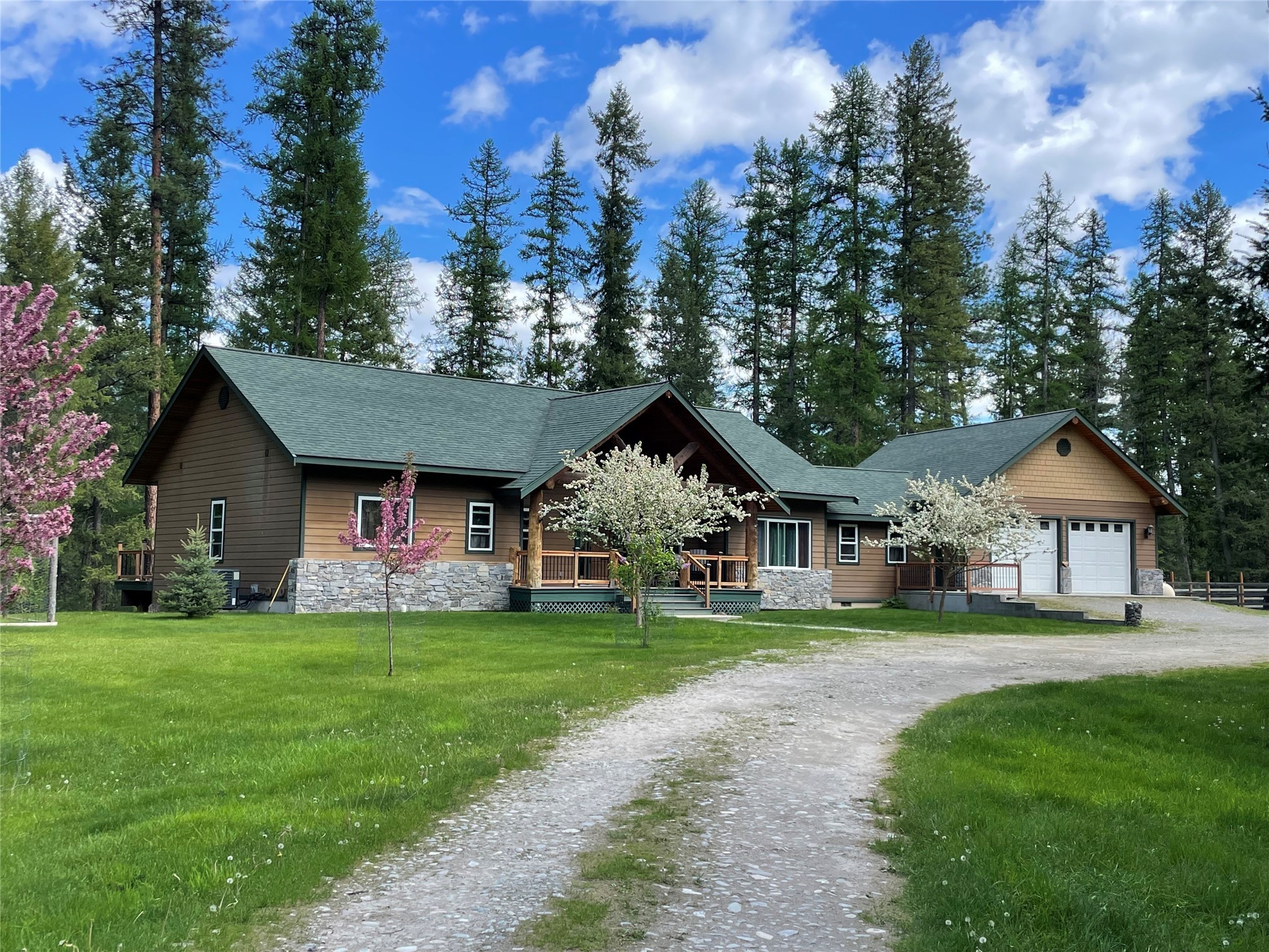 Don't miss this rare opportunity to own an exceptionally private 10+ acres along the Noxon Reservoir of the Clark Fork River, with 750+ feet of Avista frontage! This custom built 3,500+ sf home has a spacious and welcoming floor plan with a gorgeous kitchen with two islands, granite counters, vaulted ceilings, hardwood rustic sawn floors and a breakfast nook. Living space features a double-sided propane fireplace, alder doors, crown moulding, updated windows and a large, low-maintenance Trex deck with views of the river.  Master bedroom has French doors opening to deck and river views, which has been built to accommodate a hot tub. Both bathrooms feature jacuzzi tubs. Home has a propane forced air heat system for each floor and central AC. The lower level includes a family room, guest bedroom, bedroom/theatre room and a bonus room/office. Special features include log accents throughout, extensive Bose sound system with built-in speakers and a sound-insulated theatre area. There is plenty of storage in this home, with a large storage room under the stairs and a second pantry/closet in the utility room. Property also has a separate building site, with additional well and septic and a 1994 manufactured home, which could be used as a guest house, with a little interior repair.  This property has a dock permit, with exceptional water views and access to the reservoir. Gardening enthusiasts will love the fenced garden with raspberries and blueberries and an orchard area, including cherry, peach and plum trees. No covenants! Spend your days enjoying abundant wildlife from your deck and enjoy the serenity of life on the river. This is truly a one-of-a-kind offering!