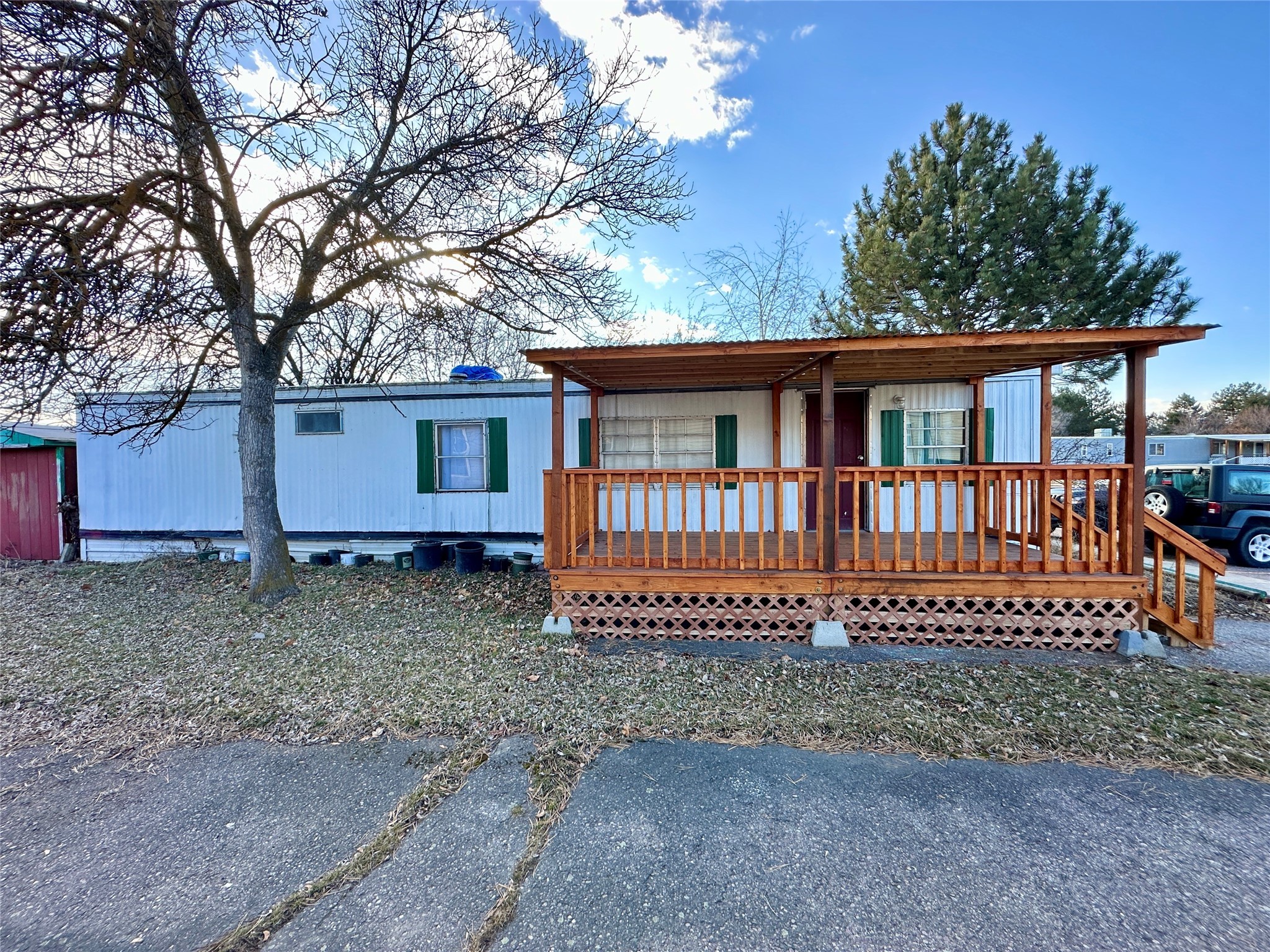 This 1972 mobile home in Travois Village has two bedrooms and one bathroom and is ready for a new owner. The front porch is covered, and there is a storage shed out back. With the right vision and some TLC, this could be a nice home at an attainable price. Potential buyers must apply online to be authorized, and the new lease/rules can be found in the associated documents. Current lot rent is $395.00 per month plus sewer and water (about $40). Rent includes two parking spaces and garbage removal.  This sale solely includes the mobile home; there is no accompanying land. Home is not built on a solid foundation. Financing may be available for qualifying purchasers through a local lender. Call Jason Shreder at 406-370-4436 or your real estate professional.