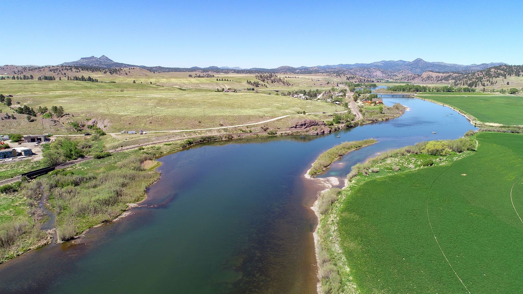 Invest in a hard-to-come-by 14 acres in the fly fishing destination Craig, Montana. The acreage offers phenomenal Missouri River and canyon views and is just off the paved Craig River Road with close proximity to town and services. The acreage is unique because it is divided by the road, so you have acreage almost ON the river with the bulk of the acreage on the hill above.  Let your imagination go wild with uses since there is NO ZONING and Craig is not an incorporated city, so no strict city rules. Build multiple houses on each lot? Take advantage of the high visibility above the river and build a commercial entity? Survey allows for single-family, but county says that a DEQ re-write not an issue. Septic was previously approved. Call Lynn Kenyon at 406-770-0013 or your real estate professional. Build your dream home on one side and use the other side for commercial. The possibilities are really endless and the traffic to Craig is brisk. Buyer to confirm all uses with county and state planning and health departments. Craig brings in thousands to fly fish and float on the river and recreate at nearby Holter Lake. Craig is nearly half way between Helena and Great Falls, so commutable. Buyers to verify all representations to their own satisfaction.