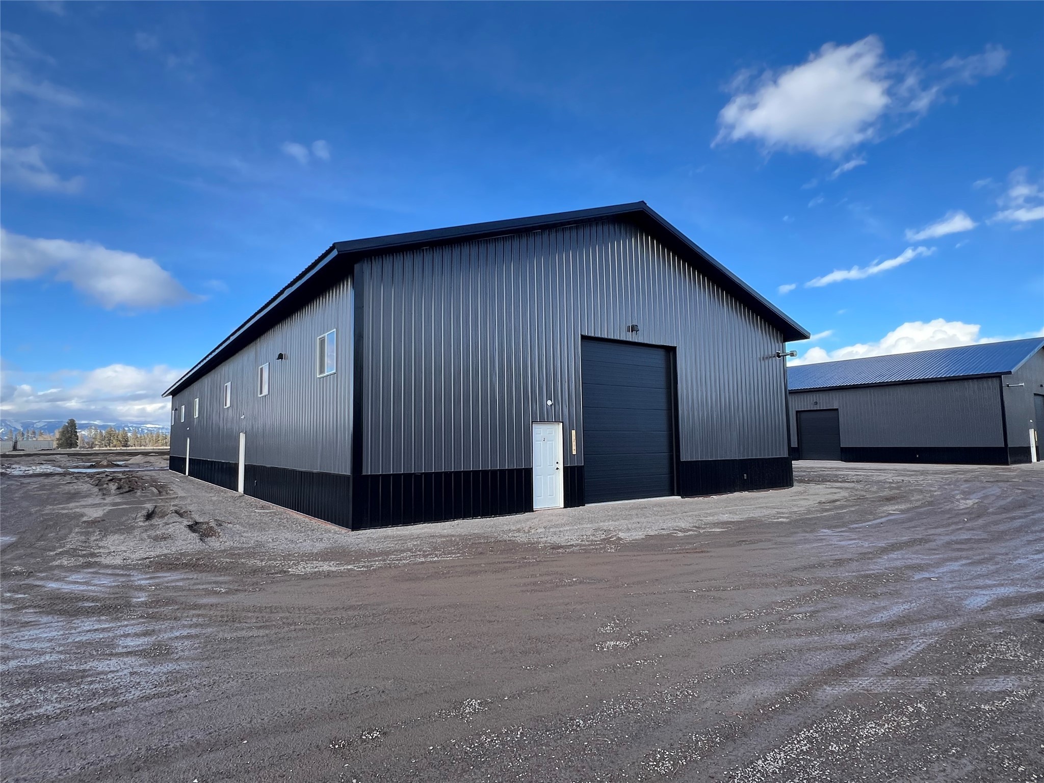 3000 Square Foot (50x60) shop/warehouse space available for lease.  This new development, with access off of Highway 2E and E Reserve, has 6000 SF buildings available as a whole or half building.  351 Unit 2 is a half building with bathroom, two man doors, and two overhead doors (12x14 and 10x12).  The building has metal walls and ceiling interior finishes, 16' walls, gas heater, evergreen water, private sewer, and 200 Amp service.  The development is paved, and set up for tractor trailer circulation and deliveries.  Call Zac Andrews at 406-250-6160, or your Real Estate Professional.