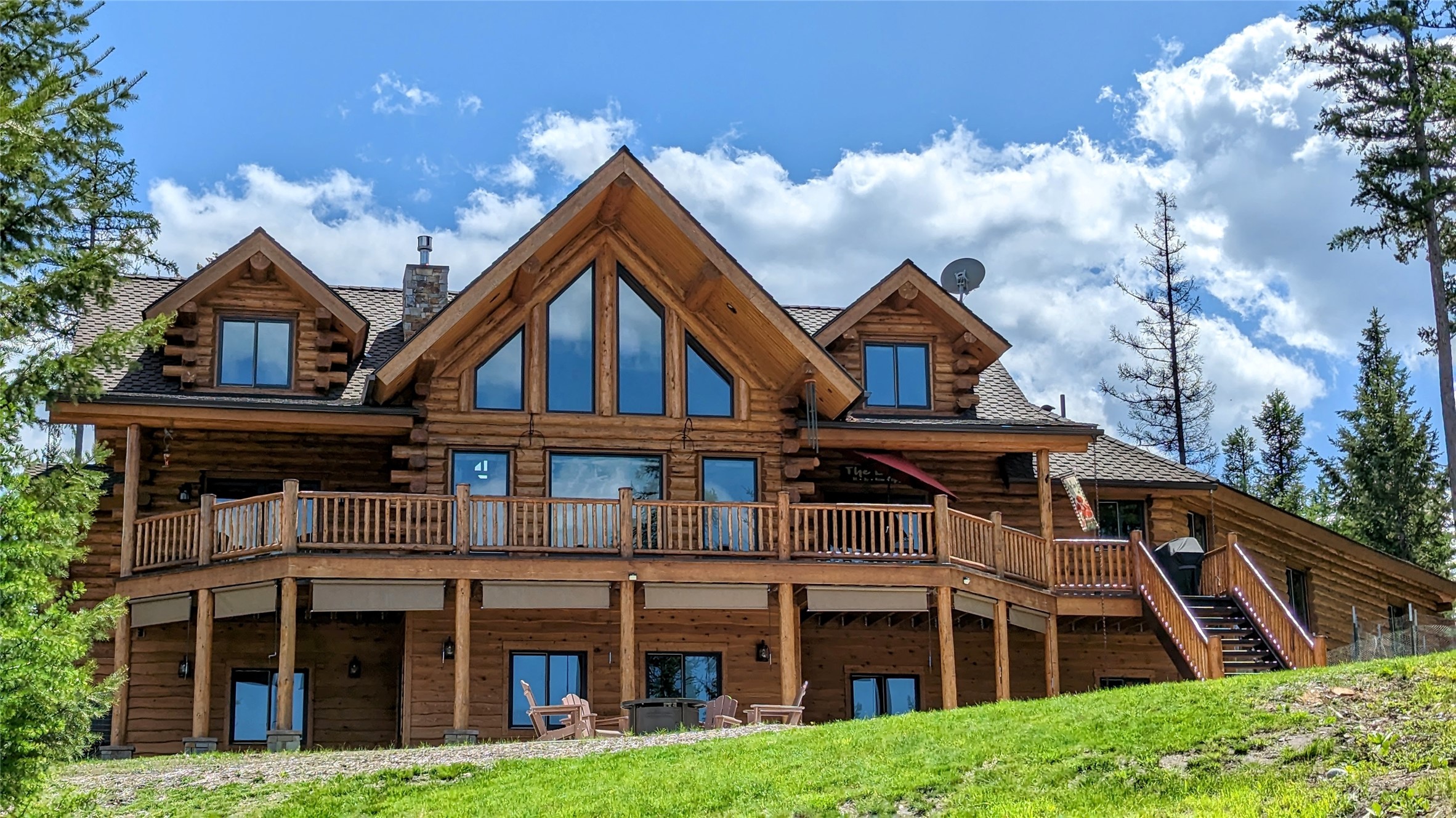 Offered is a stunning 3 bedroom, 3.5 bathroom, 4306 sq ft home on 8.75 acres with breathtaking mountain views of Bitterroot lake and the lush surrounding forest. This 2017 Meadowlark custom built log home highlights the impeccable attention to detail and craftsmanship of the traditional Amish techniques, that truly make it one of a kind. This immaculate home includes all remaining hand selected custom interior furniture, appealing to the most discerning buyers. The majesty of nature is ever-present as each window brings the outdoors in, providing a seamless blend of indoor and outdoor living. With professional landscaping, private gated entry and paved driveway, this unique property is truly the pinnacle of luxury living. Recent improvements include a spacious 52'x30' shop space for your toy and storage needs and a new outdoor 2400 sq ft patio fire pit space for entertaining guests and making memories! This property has it all, Escape to Marion, Montana and make your dreams a reality. Listed by Eric Perlstein/Brandon Trust
