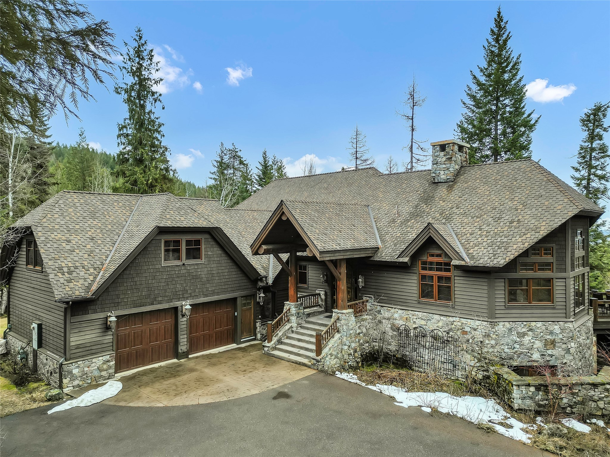 “Prestige & Comfort” in the distinguished Iron Horse community of Whitefish. Ideal as a primary residence or vacation retreat, this home is designed for gatherings with family & friends. Embodying Montana’s essence, this home features timber & stone construction, handmade railings & custom doorways. The heart of the residence is the open floor plan kitchen, dining, & great room beneath high ceilings & large windows that enhance the ambiance & lend a cabin-like feel to this luxury estate. The primary en-suite with cozy in-wall fireplace seamlessly adjoins the great room while the upper & lower levels offer versatility with a large en-suite, bunk room, pool table, & additional bedroom for guest comfort. The deck includes a wood-burning fireplace, built-in BBQ, & breathtaking views for outdoor entertainment. Convenient to downtown Whitefish, Whitefish Mountain Ski Resort, Glacier Park, & Glacier International Airport. Contact Kelly Rigg at 406-382-9518 or your real estate professional. Building plans are available. This home does not include an Iron Horse Golf or Social membership.