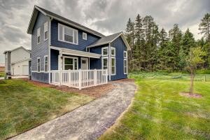 Conveniently located at the intersection of Voerman & Monegan - minutes from schools and Downtown Whitefish! The ''Apgar Lookout'' model is a 2 bedroom home, each with en-suite bathrooms, plus a main level powder bath totaling 1,270 SF. The MBR features a walk-in closet. This home has a two car attached garage, and an upstairs laundry area. The main living space is an open design with a multi-seat white quartz kitchen island for both convenience and functionality. Central Air, LED lighting. HOA covers lawn care.