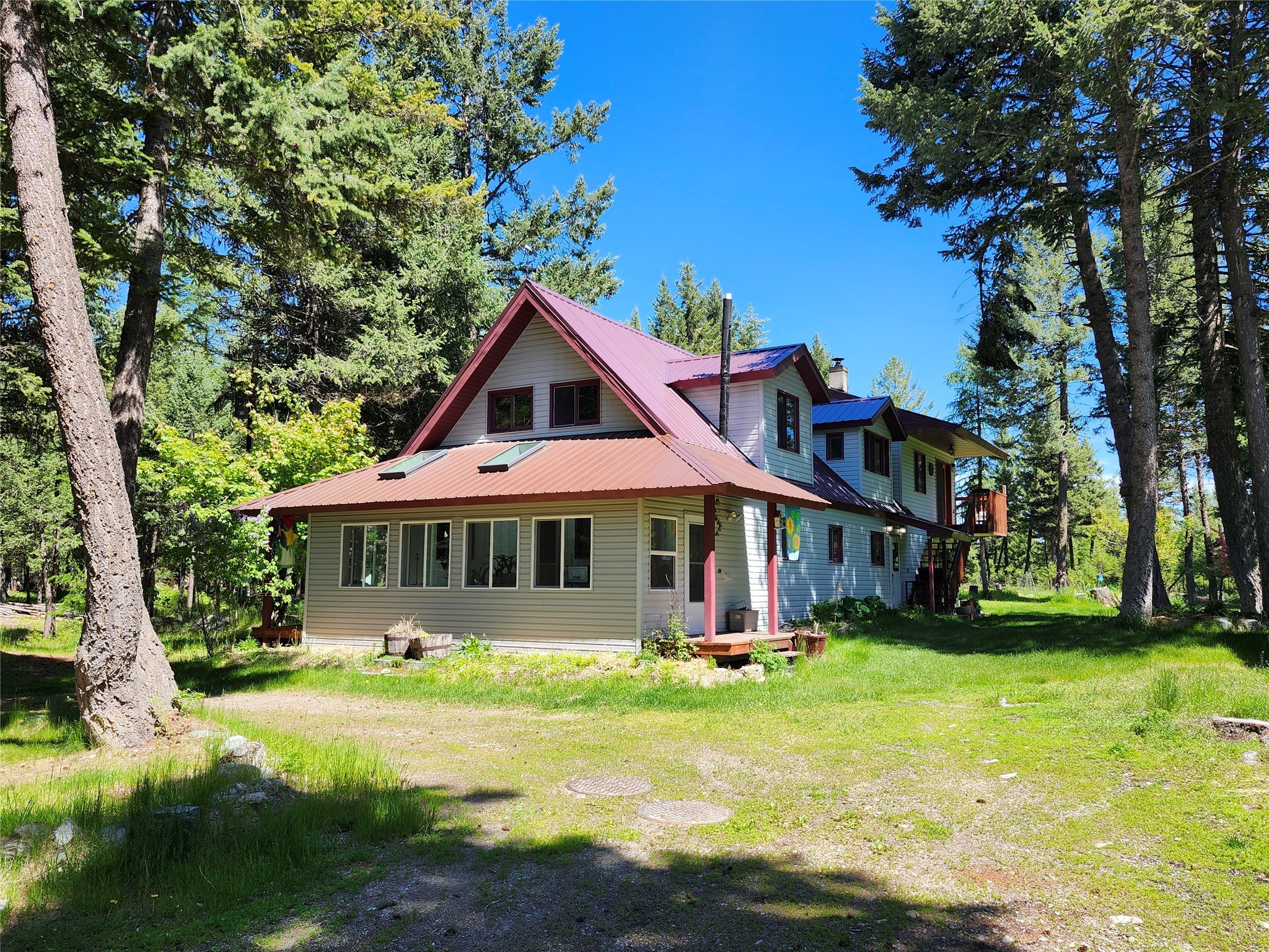 Enjoy this private retreat in the Salish mountains above West Valley, only 14 miles from town. These adjoining parcels comprise 19 +/-  acres which has been managed as a certified tree farm with a stewardship goal of improving habitat to benefit mature Douglas Fir and Western Larch.  Property borders USFS land on the eastern edge and is close on the other sides. Features include comfortable home with lots of natural light and wooden accents throughout. Kitchen boasts spacious bar and antique nickel plated wood cookstove. Warm woodstove and mini-splits for heating and cooling.  Multiple fenced garden areas. Insulated shop garage with 2 heat sources.  Pumphouse wired to accept generator in power outage. Loading dock and Polebarn for your toys.  Close to gated community. Road plowed by county.  Call Sonny Hadley 406-253-4814 or your Real Estate Professional today.