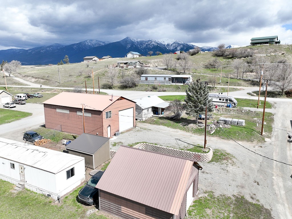 Here is an incredible opportunity to own a prime piece of real estate. This property comprises of 4 city lots and is within walking distance to schools and downtown Eureka. You'll be impressed by the features it has to offer, including a 32x50 insulated shop with a 12x14 loft with partial living quarters and a bathroom. There's a 24x24 insulated garage, 1 single-wide trailer hook-up, 3 RV hookup sites, and a small cabin that is ready to be restored (currently holds no value). The rental income generates approximately $4K per month. Don't miss out on this opportunity, call Leslie Mason at 406-334-3091 or your real estate professional for more information and make this investment a reality!
