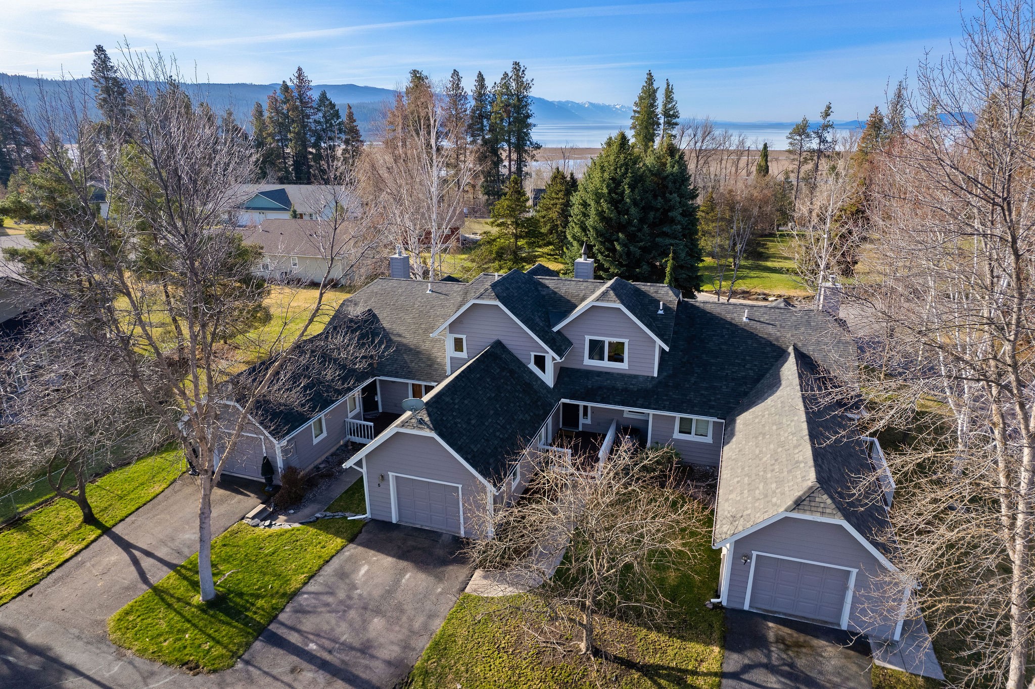 This charming townhome, located near the south end of Eagle Bend Golf Course community,  gives you a feeling of privacy as you are just off the golf course, and looks through the pines to a 'peek a boo' view of Flathead Lake. Cedar vaulted ceilings in the living room with oversized windows bringing in the light, and the rock fireplace is perfect to sit by enjoy a chilly Montana morning as you enjoy your coffee.  Spacious main floor primary bedroom/full bath with the upstairs offering a second bedroom, full bath, and open loft area currently used as a 3rd bedroom but could be a great office, work-out area, or whatever bonus space is needed.  The kitchen has granite counters, and opens to the dining and living area.  You can relax on the deck off living or the one off the upstairs bedroom.  Most furnishings and kitchen items remain so easy to move right in in time to enjoy the summer season.  Close to lake access, downtown Bigfork, MAC and golf course. Pinehurst HOA managed by Western Mountains Property Management.  Pinehurst Quarterly dues of $900.00/no transfer fee. Pinehurst covers landscaping and groundskeeping, irrigation, tree care, repairs and maintenance for buildings, gutters and painting.

Eagle Bend HOA managed by Montana Community Management Corp - Semi-annual dues of $457.00 which covers roadways, recreation areas. Maintains common areas.
$75 administrative fee at closing and a transfer fee of $229.

These Dues are subject to change.  Check with HOA management to verify.
For any short-term rental information, it is recommended you verify with Flathead Planning and Zoning and with HOA, as well. The current Conditional Use Permit for Short Term rentals would have to be re-applied for by a new owner.
