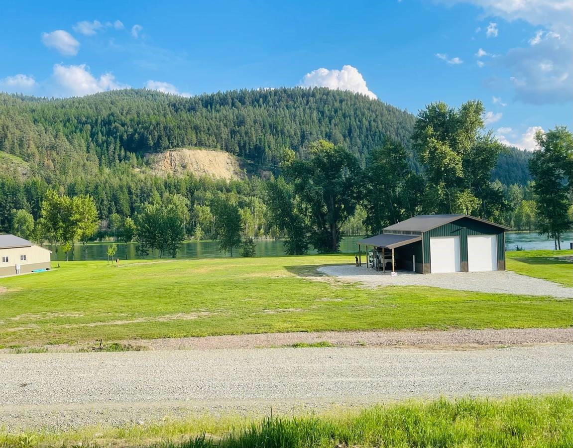 1.62 acres on Kootenai River.  2 miles north of Libby.  Spectacular views.
Shop 33 X 48 (+ 12x33 and 12x48 overhangs, full bathroom, concrete floor, water, power, etc.)
4 bars cell service
High speed internet to the shop
Septic system installed.
Well, installed (14 GPM)
Grandfathered boat access
Unrivaled Cabinet Mountain views
Fishing from the property edge
Deer, Elk, and Mountain Goats visit the property.
2 miles from Libby
Several state boat launches between Libby Dam and property (closest in 4 miles and a 90 minute float back to property given normal river flows.
MT doesn’t require building permits, so the property has light CCR’s to protect values.