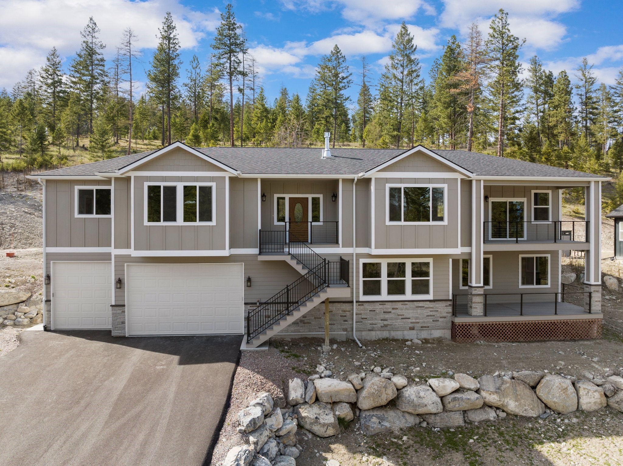 Stunningly beautiful, brand new 4,298 square foot custom home with 4 bedrooms, 4 baths on .49 acres just minutes to Flathead Lake & Blacktail Ski Resort! Enjoy the cozy gas fireplace in the large great room, the magnificent kitchen with Thermador stainless appliances, cherry cabinets, Granite countertops, and 10' breakfast bar. Office is off the living room with French doors, & slider to back deck. The 1st master suite has a huge custom closet, walk-in tile shower, & deep standalone tub.  2nd master has walk-in shower, stand alone soaking tub  & walk-in closet  The lower level has two large bedrooms, full bathroom, laundry, huge mechanical room, and huge family room. Exterior access to covered west deck off kitchen with Trex deck & iron railing, and exterior access to east deck off dining room with Trex and horizontal cable railing. Two 50 gal hot water tanks, with 29'x51' - 5 car finished/insulated/heated garage. Call Debbie Chase 406-499-1213 or your real estate professional today.