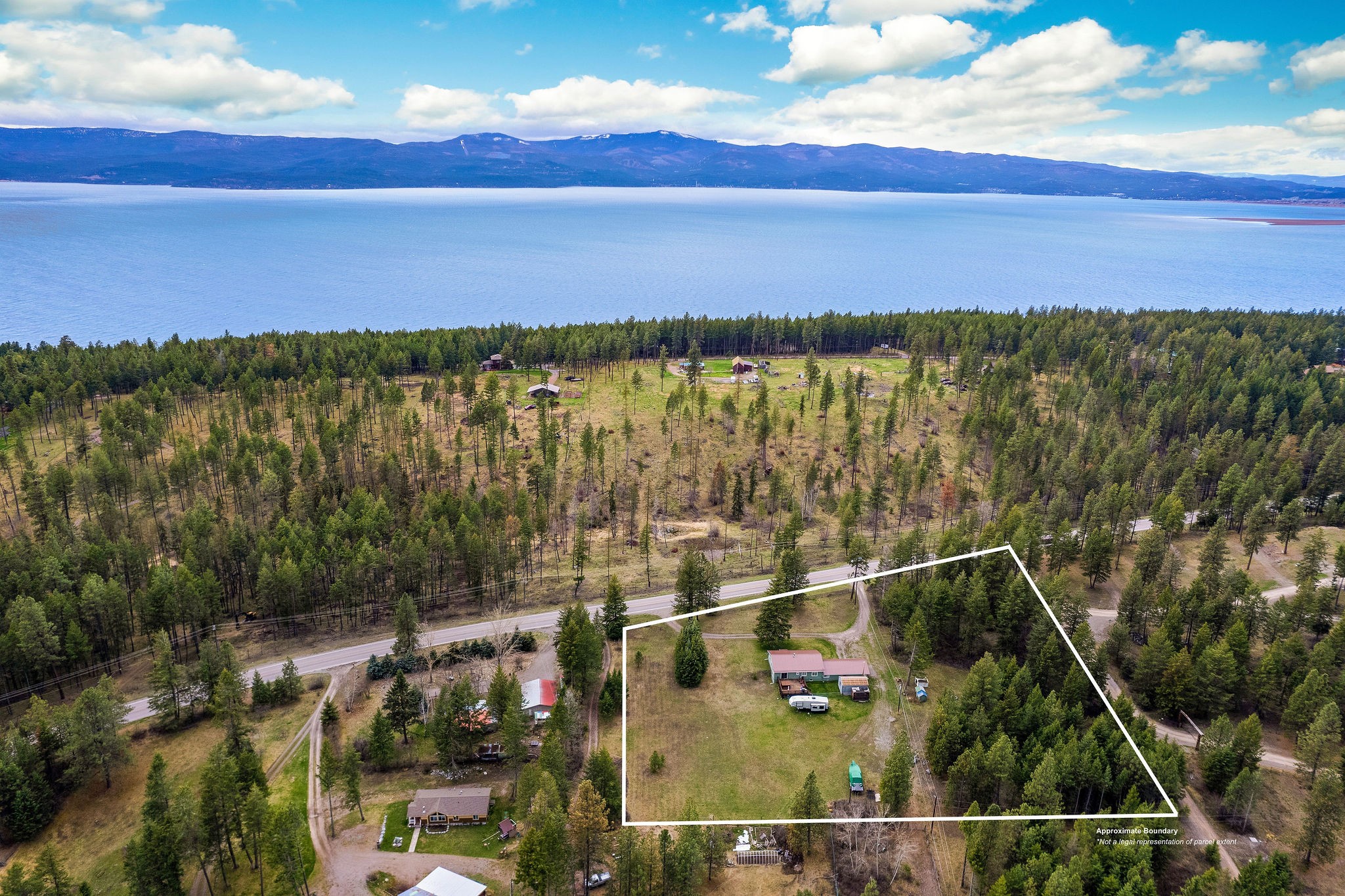 Beautiful opportunity to own a 3BD/3BA home on 3.54 level acres just steps away from Flathead Lake, the largest freshwater lake west of the Mississippi! This 2,455 finished SF home features main level living with a private back deck and hot tub and spacious yard for gatherings or animals. With no zoning, HOA, or CCRs this location makes for a prime investment opportunity to bring your vision to life, whether it’s building a guest cabin, tending cherry orchards, or raising farm animals. The 450 feet of Montana Hwy 35 frontage offers great visibility for any business opportunities. Minutes to Bigfork! Swan Lake, Echo Lake, Glacier National Park, Blacktail Ski Area, Whitefish Mountain Resort, Jewel Basin Recreational Area, and the Bob Marshall Wilderness nearby. Call Jennifer Shelley at 406.249.8929 or your real estate professional.