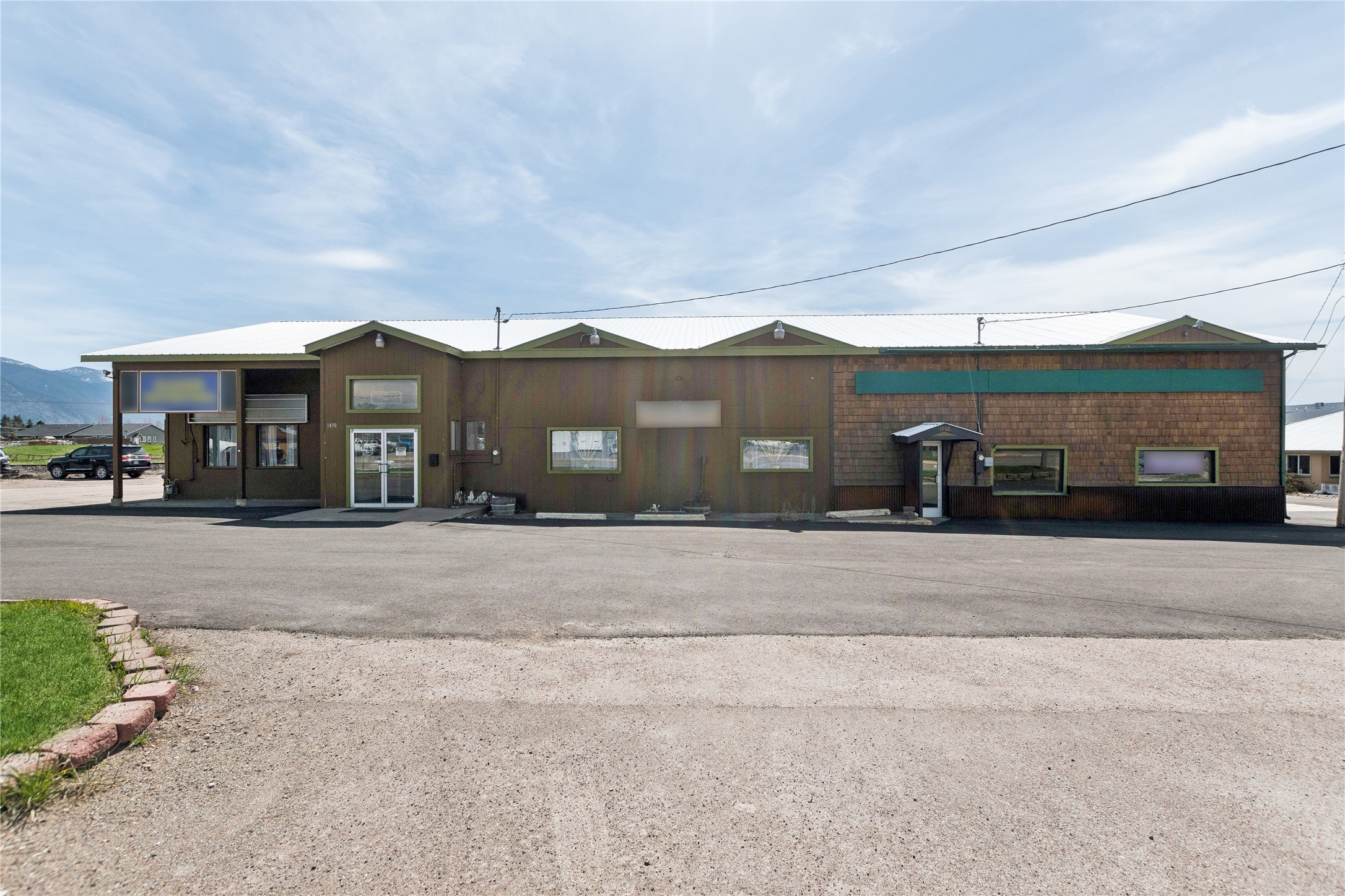 Prime investment opportunity situated on Highway 2 with over 320+ feet of frontage and a 25,000+ daily traffic count. This property offers an enviable location for business ventures. Enjoy the spaciousness of this lot with two buildings that total 8739 sq feet with plenty of paved parking. Benefit from the presence of four long-term tenants, which bring in $10,000/m currently, and will go up July 2025. Located in a thriving commercial zone, this property stands as a beacon for businesses seeking growth opportunities, especially with its proximity to Glacier National Park. With established tenants already in place, investors can enjoy stable cash flow from day one. Positioned in a rapidly expanding area with the combination of a prime location and thriving community, make this an attractive investment opportunity. Seize the chance to enhance your investment portfolio in one of Montana's most promising areas. Schedule a showing today to explore the potential this property holds!