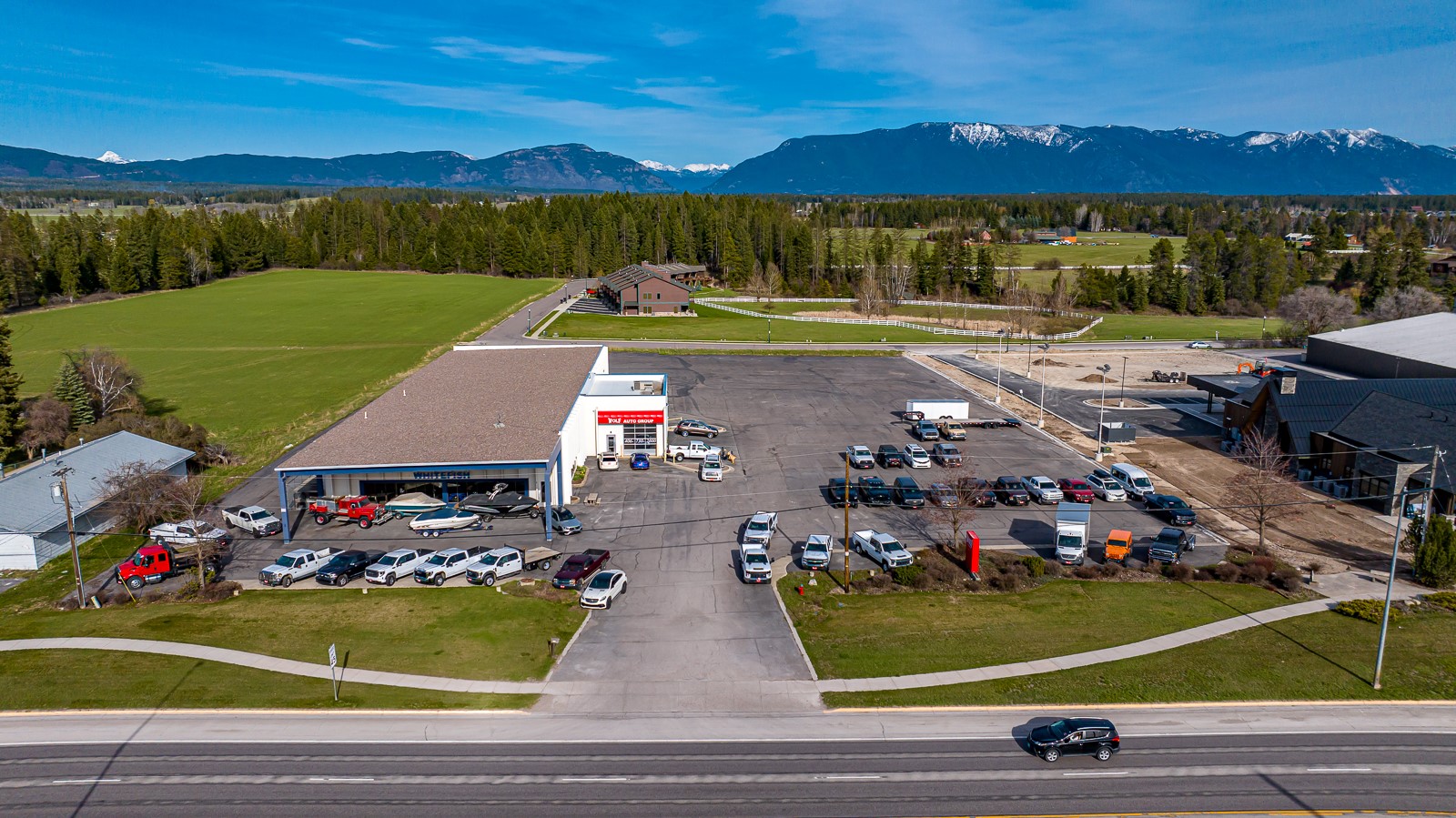 Exceptional commercial opportunity strategically poised along the bustling Highway 93 corridor leading into Whitefish! This property offers unmatched exposure and visibility for businesses seeking to thrive in a high-traffic location with over an impressive 25,000 average daily traffic count. Situated on a generous 3-acre parcel, this property was tailored to meet the needs of various commercial enterprises. Offering a total of 6 offices, 10 showroom offices, large service center and shop, and 2 sets of public restrooms, provides ample space to conduct business operations with utmost efficiency ensuring the convenience and comfort of clientele & staff alike. Well maintained, and ideally situated just minutes from vibrant Downtown Whitefish providing easy access to fantastic dining options, amenities, & recreational activities the area has to offer. Don’t miss this extraordinary opportunity to establish your presence in one of Montana’s sought after commercial corridors. Call Sean Averill (406)253-3010 or your real estate professional for more information.