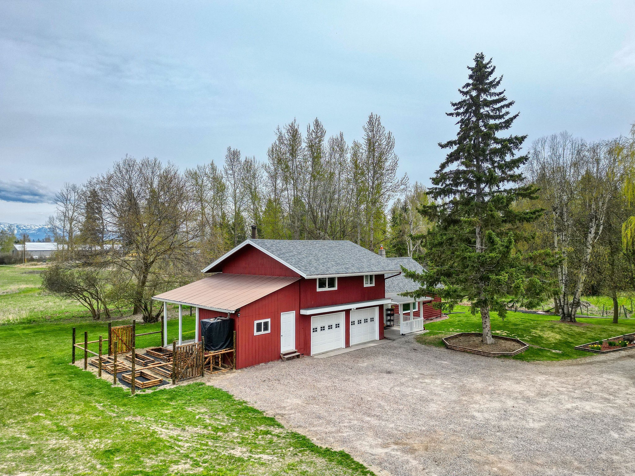 If you’re a little bit country and like the idea of being in town too…How does a Farmhouse in Montana on 1.21 acres sound for the perfect place to call home? Welcome 35 River Rd. in Kalispell! Step into Montana farmhouse living at its finest, where every detail has been carefully crafted to perfection. Completely remodeled, this home seamlessly combines rustic charm with modern convenience. The heart of the home is the brand-new kitchen, boasting butcher block countertops, cabinets, and backsplash, complemented by state-of-the-art appliances and a ton of pantry/storage space. Whether you're preparing a family feast or entertaining guests, this kitchen is sure to impress. 4 bedrooms, 2 baths; with two bedrooms, one bath and an office on the main level, there's plenty of space for everyone to spread out and relax with a roaring fireplace in the living room. Please call Leah Lindsay at (406)261-1859, Kayla Chamberlain at (406)471-9693, or your real estate professional. Gaze out the humongous picture window in the living room while enjoying the view of two of the most mature Willow Trees in the flathead!
The primary en-suite, located upstairs, features a wood fireplace, built-in closet, stunning bathroom and a small deck where you can unwind and soak in the panoramic mountain views. There’s another large bedroom up a separate staircase for privacy, you’ll also find a cold storage attic completely insulated for all your storage needs. 
There was a brand new roof and gutters installed in 2023!
Outside, the possibilities are endless on the expansive 1.21-acre property with attached two car garage and a bonus heated room that could be a craft room/shop/office area. There’s potential for a dog run/garden area as well as a small 10 x 20 garden complete with a fresh water cistern for your gardening needs!
Imagine enjoying morning coffee on the open front porch, or a roaring in the evening hanging by the firepit surrounded by  the tranquility of nature. With room to expand, the potential for this property is limitless. 
Nestled amidst the breathtaking Rocky Mountains, this charming home offers incredible views of nature's wonders, including glimpses of Glacier National Park. 
Conveniently located close to town yet offering the privacy of country living, this home truly offers the best of both worlds. Don't miss your chance to experience Montana living at its finest – schedule your showing today!