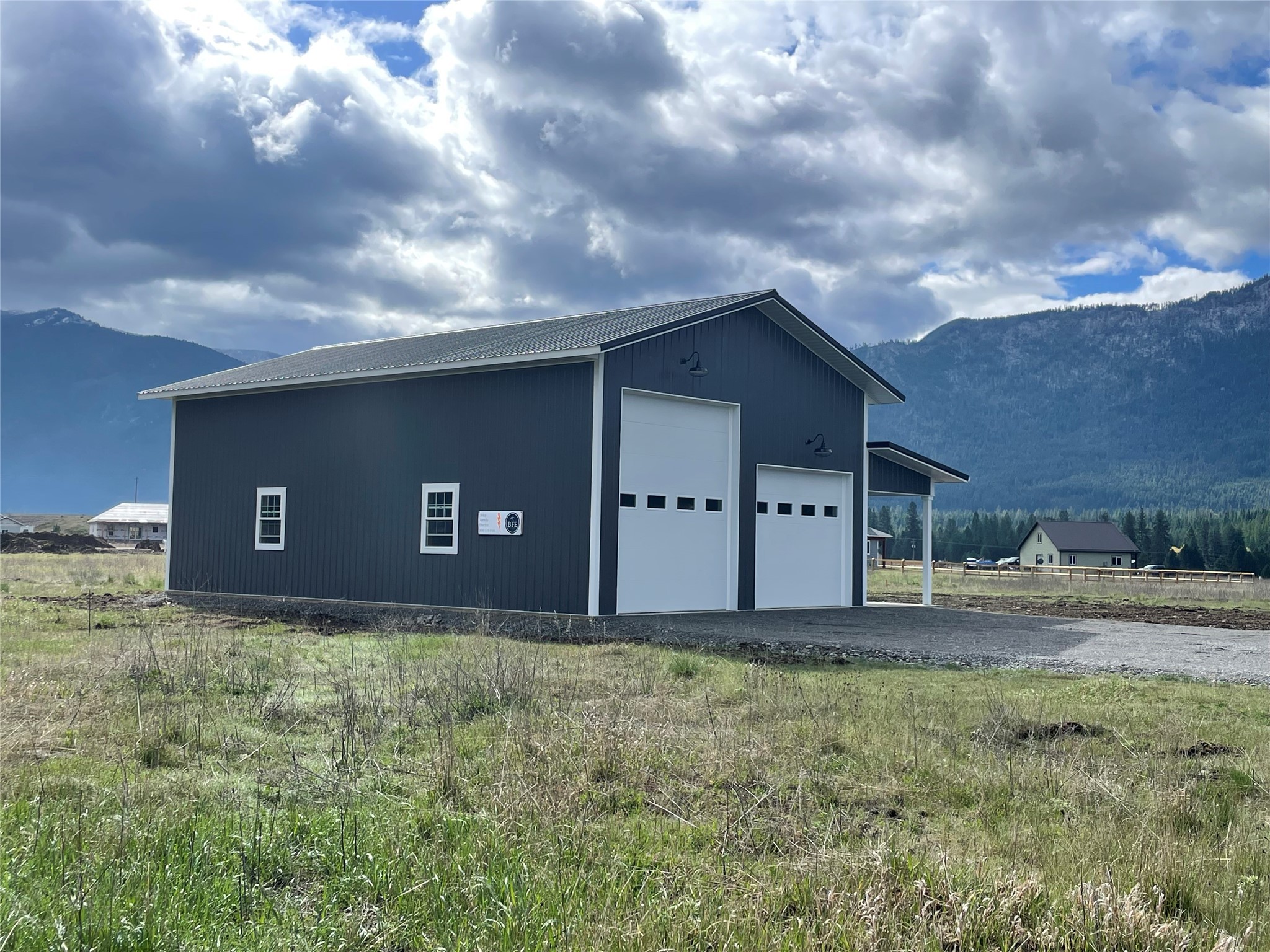 Brand new beautiful shop on .75 acres with water, power and septic installed!  This quality building includes shop space, 30'x48' with 16' ceilings and a 10'x48' lean-to with concrete floor and partially enclosed with bathroom area plumbed in.  Building includes 2 overhead doors with openers, 12'x14' and 12'x10'.  Ceiling is finished with metal, with insulation blown in.  This quality shop was built to last, with posts bracketed unto concrete, not set in the ground.  Septic is permitted as a 4 bedroom, ready for a new home, if you choose.  Property is also ready for RV use, with a full RV hookup and gravel pad.  So many possibilities with this property! Property also has access to Salish Shores private boat launch.