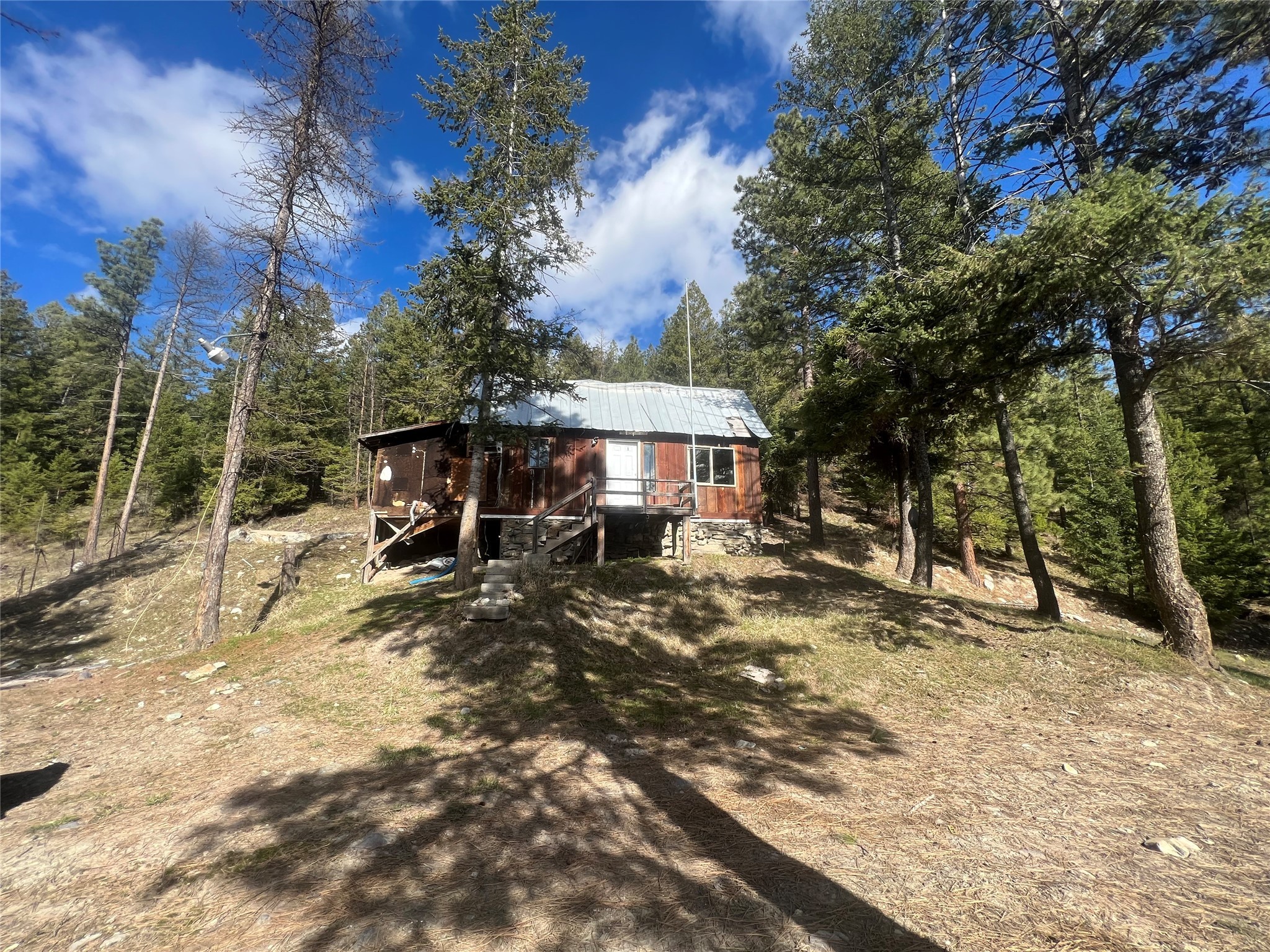 This private secluded property of 4.91 acres boasts amazing views of The Smith Valley.  Being bordered mostly by Stoltz Land your privacy is abundant!  This property has its own well septic is on the property as well as electric.  Great opportunity at a great price for you to own almost 5 acres in beautiful Montana!  This home could use work or could be torn down and start your future with a clean slate!  The views from this property are amazing and with a little tree work, you'll be astonished! Call Cody Butler @ 406-471-2005 or your real estate professional.