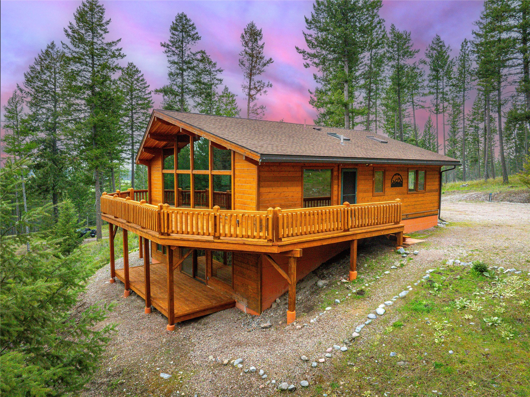 Imagine starting your day sitting in the morning sun on your private deck with a hot cup of coffee. Gazing up through the trees at the Mission Mountains, serenaded by the sounds of the forest & nearby cascading mountain stream. It just doesn't get much better! This Lindal Cedar Home sits on almost 11 acres that, while only 20 min to Polson, feels remote as it borders Tribal forest. The open floor plan, complete with wood covered cathedral ceilings & floor-to-ceiling windows, allows the Living/Dining/Kitchen areas to blend and create an elusive spacious, cozy feeling that whispers "Home" that many larger houses lack. 2 floors w/3 bedrooms (Master ensuite & large walk-in closet) & 2 additional baths, an abundance of storage, daylight basement rec/TV room w/small deck, laundry room, & an insulated double-car garage. The property has been "parked out" with wild flowers making it a nature lovers delight. Call Susan Raub-Fortner (406)370-2076 or your real estate professional.