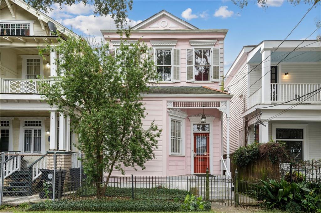 Get ready to embrace the vibrant spirit of Mardi Gras in this stunning Victorian fixer-upper from 1900! This unique property is a golden opportunity to invest in the heart of New Orleans, just one block from the streetcar line and a stone’s throw from the lively parade route. Imagine stepping out your front door and diving right into the excitement of the festivities!

This home is filled with character, featuring grand woodwork and soaring high ceilings that reflect the rich history of New Orleans. The original crown molding is just waiting for your creative touch. Picture hosting friends and family in the classic courtyard, where you can celebrate Mardi Gras surrounded by blooming pink camellias and a majestic century-old crepe myrtle.

With three spacious bedrooms and two and a half bathrooms, this sizable property is ripe for customization. The original wood floors are ready to shine with a little TLC. Envision the charming gingerbread wood scrolling and functional working shutters as your canvas for style, transforming this house into a true masterpiece!

This isn’t just a home; it’s your chance to invest in the magic of New Orleans culture. Whether you want to create a warm family retreat, a festive hosting space for Mardi Gras gatherings, or a lucrative rental property that celebrates the city’s vibrant spirit, this location offers endless possibilities. Don’t miss your chance to dive into the fun and make this Victorian gem your own! Schedule a visit today and let the Mardi Gras magic inspire your vision!