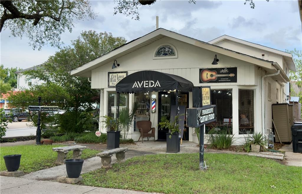 RARE mixed-use Commercial/Residential building on busy Canal Boulevard corner across from shopping area. Building consists of one 2-bedroom 2.5 bath two story residential unit and two 500 SF commercial units that could be combined into one contiguous unit. Residential unit has a private driveway allowing gated parking for one car (currently used as a courtyard with Jacuzzi). The lower floor contains the living room, 1 bedroom, half bath and a laundry/storage room. The bedroom has an attached bath and a side exterior entrance and could be a third commercial space.  Upstairs you will find a full kitchen with breakfast bar, dining area, large bedroom and a full bath with jetted tub and a cute coffee nook with balcony overlooking the courtyard.  The 2 commercial units are currently occupied by the owners as a hair salon and music studio. The sellers also occupy the residential space on a part time basis, making it the perfect live/work combination. The flexible floorplan with exterior doors on all 4 sides allows for further rearrangement of the spaces and the possibility of adding a second floor to the front portion. The unbeatable location on busy Canal Boulevard with easy access to I-610, proximity Harrison Avenue restaurants, schools and shops and City Park provides ample opportunity for a business that desires ample drive-by exposure.