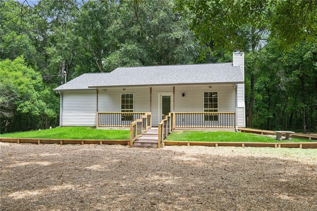 MUST SEE! Lake Vista’s finest home in the woods of Covington, located on the sought-
after Horse Branch Rd. This secluded one-acre property has been updated with new
plank flooring throughout—no carpet. Tile flooring is featured in the bath and kitchen
areas. The kitchen includes updated countertops and all new built-in appliances. The
entire interior has been freshly painted. A new HVAC system has been installed and the
hot water heater has been updated. Fresh gravel has been added to pave the entrance
and private driveway. A new retaining wall supports the soil, and front porch railings and
steps have been installed. Additionally, there is an oversized, newly constructed
wooden back porch. Free 1yr interest rate buydown and no lender refinance fees for qualified
buyers when using Envoy Mortgage.