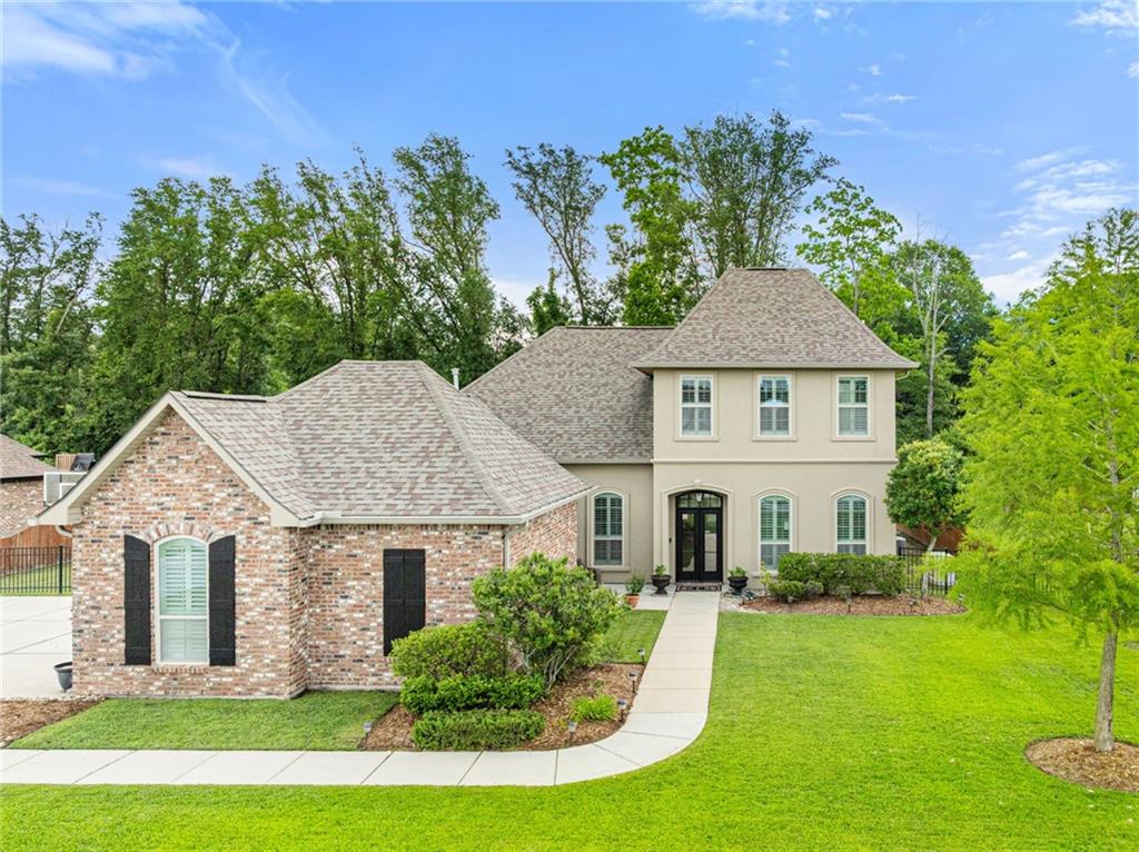 Welcome to your dream home! This stunning property, built in 2017 and lovingly maintained by its original owner, offers a perfect blend of modern design and luxurious comfort. With 5 bedrooms, 3 bathrooms and a large addition on the patio, this home provides ample space for family living and entertaining.

As you enter, you'll be greeted by soaring 10-foot ceilings and fresh paint throughout. The entryway features elegant custom wainscoting, setting the tone for the exquisite details found throughout the home. The large chef's kitchen is a culinary enthusiast's delight, boasting a generous island, stainless steel appliances, 3cm granite countertops, and a brand-new gas stove, complemented by custom lighting above and below the cabinets.

The first floor features stunning new vinyl plank flooring and elegant crown molding throughout. The primary suite serves as a peaceful retreat, highlighted by a vaulted ceiling. The primary bathroom offers a walk-in shower, a separate soaking tub, a double vanity, and a walk-in closet. A second bedroom is conveniently situated downstairs, making it great for guests, along with a nearby bathroom. 

Upstairs, you'll find plush new carpeting in all three bedrooms. There's also a large bonus room that can serve as a playroom, home office, or additional living space. 

There's also a mud room with a bench, cabinet storage, and hooks for bags, conveniently located next to the expansive laundry room. The laundry room is enhanced with additional shelving and a hanging bar.

Practical amenities include a whole-home generator as well as a whole-home surge protector to never leave you in the dark. Another plus is the spacious two-car garage comes with built-in storage shelves, ensuring ample space for all your needs. Situated next to the neighborhood pool and featuring a neighborhood playground too, this home is great for buyers who enjoy outdoor activities. Don't miss the opportunity to make this exceptional house your new home!