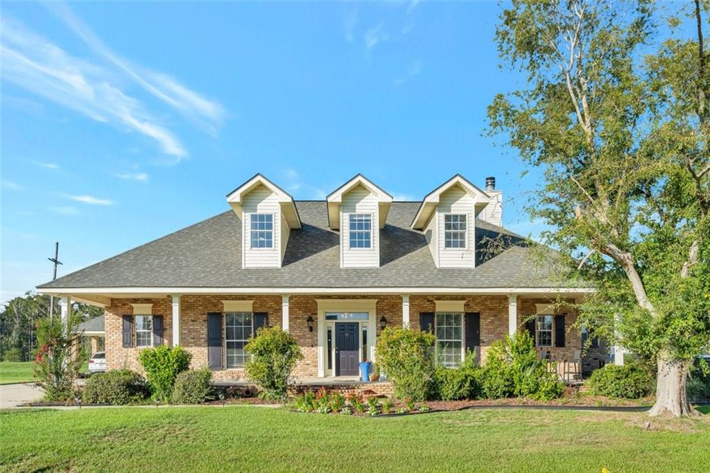 Welcome to 324 Beaupre Drive, Luling, Louisiana, where luxury meets functionality in this custom-built home offering an abundance of space. Boasting 4 spacious bedrooms, 3.5 baths with no backyard neighbors. Large inviting front porch, perfect for enjoying morning coffee. Step inside to discover a well-designed floor plan featuring 10’ ceiling, a breakfast area, formal dining room, and a spacious living area, ideal for both everyday living and entertaining guests. With a new Post-Ida roof and windows, as well as a whole house generator, you can enjoy peace of mind knowing that this home is equipped to withstand the elements and provide comfort in any situation. Outside, the rear screened porch offers a serene space to unwind and enjoy the beautiful Louisiana weather, while the above-ground pool provides a refreshing escape during the warmer months. The expansive rear yard offers plenty of space for outdoor activities and is complemented by a 1400 square foot garage with a workshop area and a giant carport, providing ample storage for vehicles, tools, and more. If you're searching for extra space and modern amenities in Luling, look no further. With its combination of elegant design, practical features, and prime location, this home offers the perfect opportunity to experience luxurious living in a vibrant community.