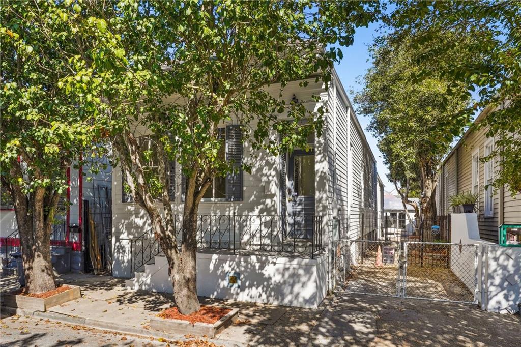 This amazing renovation of a historic Marigny home offers all the modern conveniences and finishes while keeping the original character intact. This entertaining dream home has an open Living/Kitchen with windows everywhere to let tons of natural light flow in. Original hardwood floors grace the entire home besides the baths/laundry. The Kitchen cabinets are custom with quartz countertops and luxury appliances including a 36 inch range and drawer microwave. Designer touches in every corner make this a truly spectacular home! High ceilings carry throughout. Luxurious baths make it a spa like experience. There is a 773 square foot storage that can be converted or turn it into a fabulous outdoor oasis by adding a pool! More storage on the side adds to pluses! The driveway can accommodate several cars! Make an appointment today!