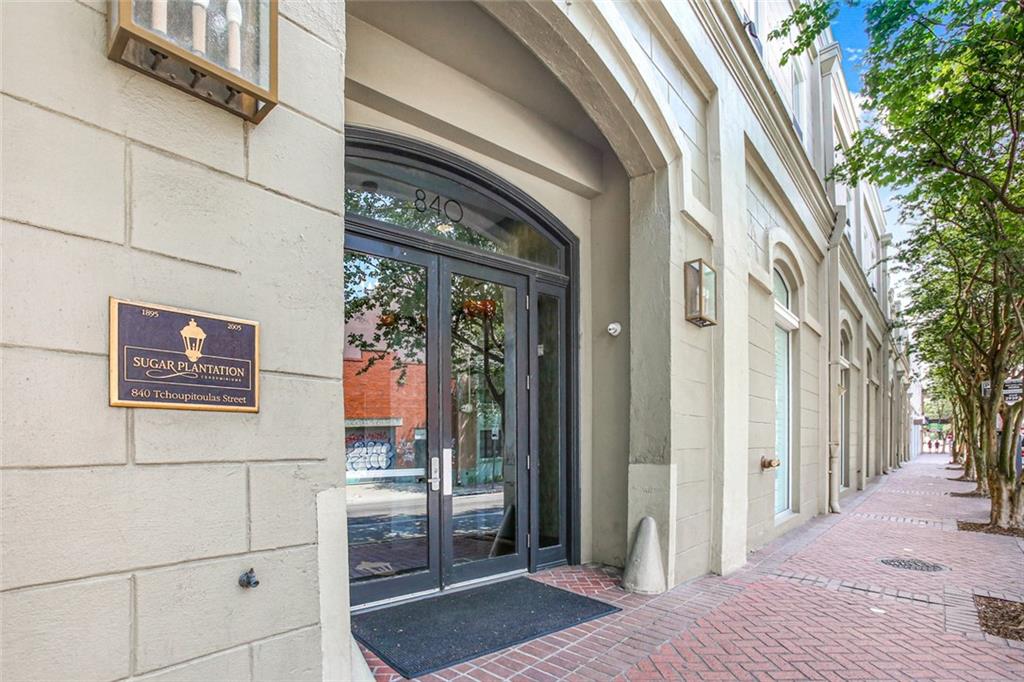 Priced below appraisal!! Gorgeous & spacious 2 bed 2 bath corner unit with 12’ ceilings throughout and a 276 sqft private balcony overlooking Tchoupitoulas Street - a prime location to watch the Bacchus parade!  Recent upgrades include white oak wood floors throughout, new HVAC, new water heater, new light fixtures, and complete bathroom renovations in 2019.  Bright open kitchen with quartz countertops offers bar top seating for 5 people.  Primary bath features a 2 person tub/shower combo and an inline water heater, so you never run out of hot water!  Two walk-in closets feature new cabinetry for optimal storage.  Spacious laundry closet has room for storage and a new full-size washer/dryer combo.  Unit 224 includes a deeded parking spot large enough to fit two vehicles side by side, and a 10’ x 10’ x 10’ climate controlled storage room.  Building amenities include a gym, pool with barbeque grills and new patio furniture, and a community room that can be reserved. Very strong and well run condo association with an on-site manager.  Steps to Julia Street galleries, restaurants, shops and much more!  Across the street from the luxurious Common House coming soon!  www.commonhouse.com/neworleans