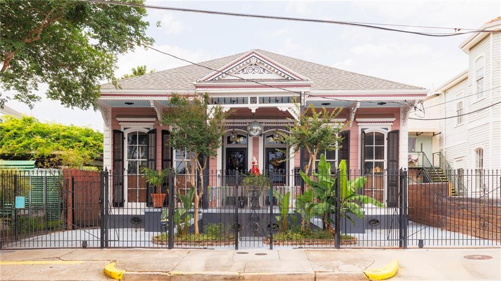 Welcome to 3029 Royal Street, a lovingly restored home that marries historic grandeur with sophisticated modern style. Situated in the heart of New Orleans's most creative neighborhood, this spacious property, at 4,100 square feet, offers several living options, including a grand single-family home, 2-3 private residences, or the potential to continue generating income as a bed and breakfast (inquire for details). 

The current homeowners are celebrated for their work across the globe in part due to the tremendous love and painstaking attention to detail they pour into rehabbing homes. This has resulted in this home being featured in glossy magazines and design books alike, most recently Bohemian Soul. It includes 6 bedrooms, multiple workspaces, and 5 baths, allowing the various configurations to suit your individual lifestyle (see floorplan). 

Just some of her key features include a grand front parlor, two gated parking spots, a welcoming front porch, a large rear porch and courtyard perfect for entertaining, a guest kitchen, and a main kitchen with a high-end gas stove and oven. The whole-home generator ensures reliability even during outages. 

A private, upstairs pied-à-terre apartment provides a third additional living or rental space.

Original hardwood floors, elegant pocket doors, and nine decorative fireplaces nod to the property's rich history. Upgrades ensure it exceeds today's living standards. 

The bespoke furnishings are available for purchase, making it possible to maintain the designed interior. 

The home is within walking distance of acclaimed restaurants, pubs, cafes, and parade routes. The street hosts near-weekly second lines. 3029 Royal Street offers an opportunity to establish roots in a neighborhood unrivaled in its eclectic atmosphere. Live in a space where every room is a statement and become a part of the city's vibrant story. Schedule your tour today. A gem this rare won't stay on the market long.