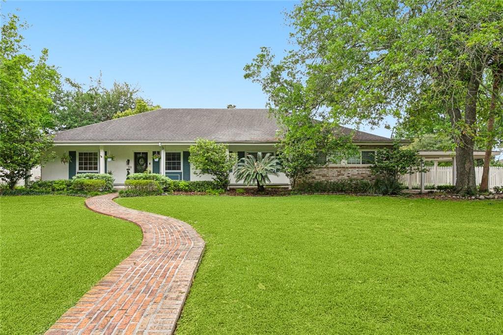 This ranch-style home in the heart of Metairie is a pure gem, with its impeccable craftsmanship and stunning features, it's sure to capture attention. As you enter the home, you're greeted by the warmth of gorgeous Pecky Cypress and Pine walls, ceilings & flooring, adding a rustic yet elegant touch to the interior. The updated kitchen is a chef's dream, boasting stone counter tops, stainless steel appliances, including a Wolf range & a large center island perfect for meal prep and casual dining. The enormous den, with its 10-foot ceilings and wood-burning fireplace, provides a cozy and inviting space for gatherings or relaxation. The spacious primary bedroom offers a retreat-like ambiance, while the additional bedrooms provide ample space for family or guests. The versatile office can easily serve as a fifth bedroom or bonus room, catering to various lifestyle needs. Outside, a private patio and porch overlook the over-sized backyard, offering a tranquil setting for outdoor entertaining or simply enjoying the lush surroundings. With a half-acre lot, there's plenty of room for outdoor activities. This home combines charm, functionality, and luxury, making it a standout property in the desirable Metairie area.
