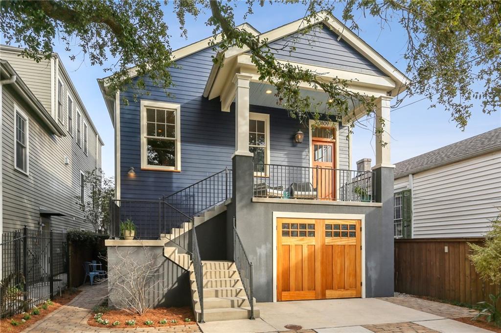 Unique opportunity to live on the edge of the French Quarter in the historic Marigny Triangle.  This home has many features you won’t find elsewhere in the neighborhood.  Walk to Frenchman St. or the French Quarter, but still have the ability to park *five* cars off street with three inside!  This craftsman-style home was built ground up in 2015 and includes both modern luxury and historic charm.  The main home has 3 bedrooms and 2.5 baths with a large open floorplan on the main level and a separate dining room. The kitchen features marble countertops, custom cabinetry, all Thermador appliances, and a large walk-in pantry.  The main level opens to both front and back porches with French doors and transom windows across the rear maximizing indoor/outdoor living potential.  The third floor features three light-filled bedrooms with a separate laundry room adjacent to the primary suite.  There is also a bonus room located off of one of the three bedrooms that could be used as a studio or playroom.  The first floor includes an 800 sq ft garage/workshop space that can accommodate three cars and is fully conditioned, but not included in the listing square footage, and a one-bedroom apartment that can be accessed from the outside or through the garage.  The apartment contains a living room, bathroom full second kitchen, and an additional bedroom with ensuite second laundry.  Use as a mother-in-law suite or realize income potential.  The front and rear yards are fully landscaped including custom pavers, raised beds, a smart drip irrigation system, and wired low-volt uplighting.  The rear yard evokes a tranquil French Quarter courtyard with well-maintained Lilly Pad Pond shaded by mature bottle brush trees.  Sit on your front porch amid the branches of a large live oak, another rarity for the neighborhood.  X-flood zone, low insurance premiums due to new construction.  New roof installed to fortified roof standards, exterior upgrades, and tankless water heater in 2023.