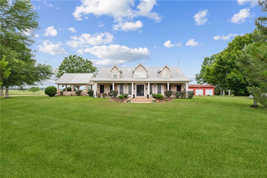 Set on a sprawling 15.9 acres of rolling countryside, this property is a haven for those seeking a rustic yet refined lifestyle. The Acadian home exudes Southern charm, with its high-end upgrades enhancing its cozy appeal. Step outside to savor evenings by the pond or take a dip in the pool, all while soaking in the breathtaking vistas. The guest house offers a welcoming retreat with over 1000 sqft of living area including full kitchen, living, bedroom and bath! With energy-efficient solar panels, a spacious workshop, and fiber internet this property offers the perfect blend of country living and modern conveniences, a true gem waiting to be discovered!