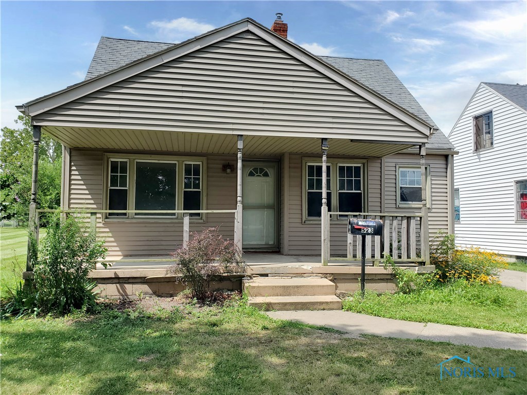 Nice location across the street from Collins Park golf course. Two bedrooms and One Full bath on main level. Large dormer up could be a large 3rd bedroom. Full basement plus a 2 car detached garage. Some hardwood flooring.