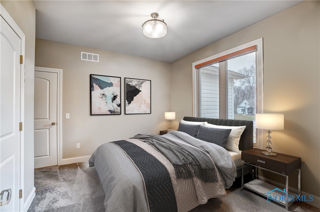 Virtual staging photo -Sellers are willing to remove french doors and add wall if buyer prefers for added privacy to bedroom.  Example of what that would look like.