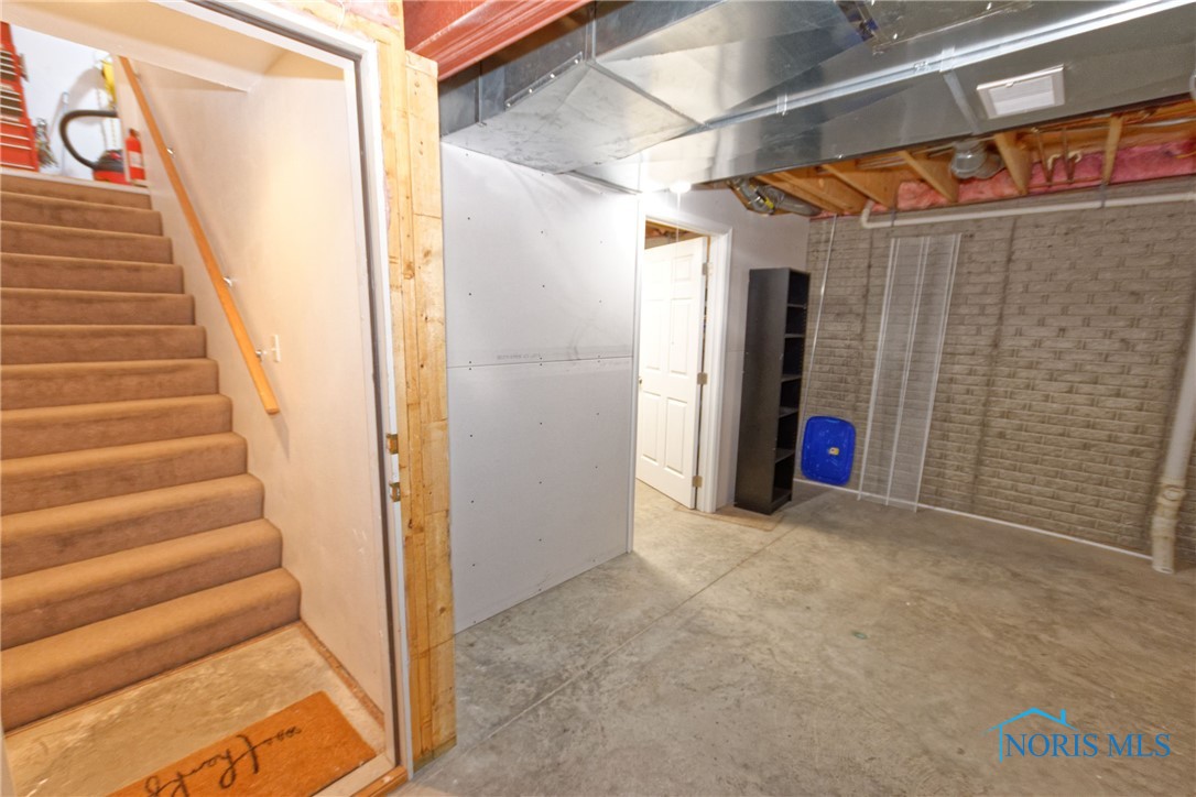 BASEMENT STORAGE ROOM / STAIRS ACCESS TO GARAGE