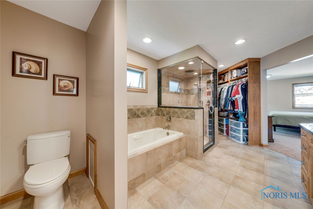 Custom Master Bathroom features steam shower, jetted soaking tub and two custom closets