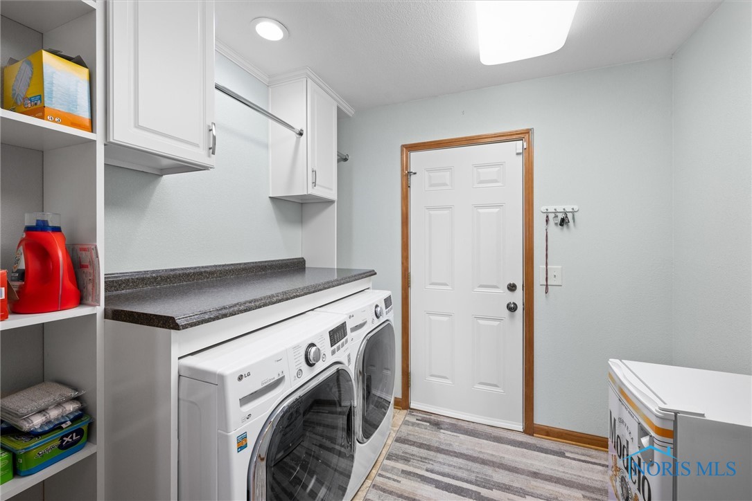 Laundry room and entrance to garage.  Both the laundry room and the garage have great cabinetry and storage options.