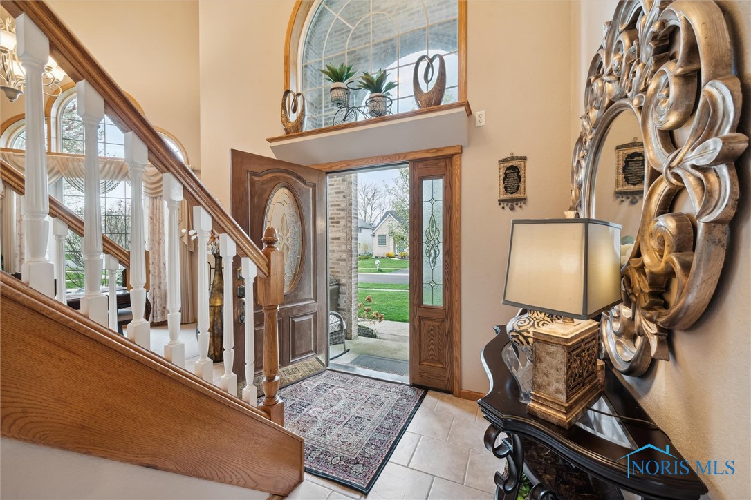 GORGEOUS ENTRYWAY WITH LEAD GLASS WINDOWS FOR LIGHT BUT NO VISIBILITY AT THE FRONT DOOR. RING CAMERA LETS YOU KNOW WHO IS THERE.